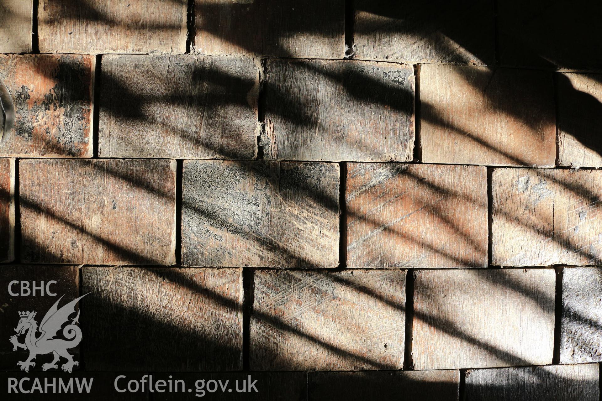 Investigator photographs of Conwy Suspension Bridge Keepers cottage. Interior: wooden tiles laid in the bed room.