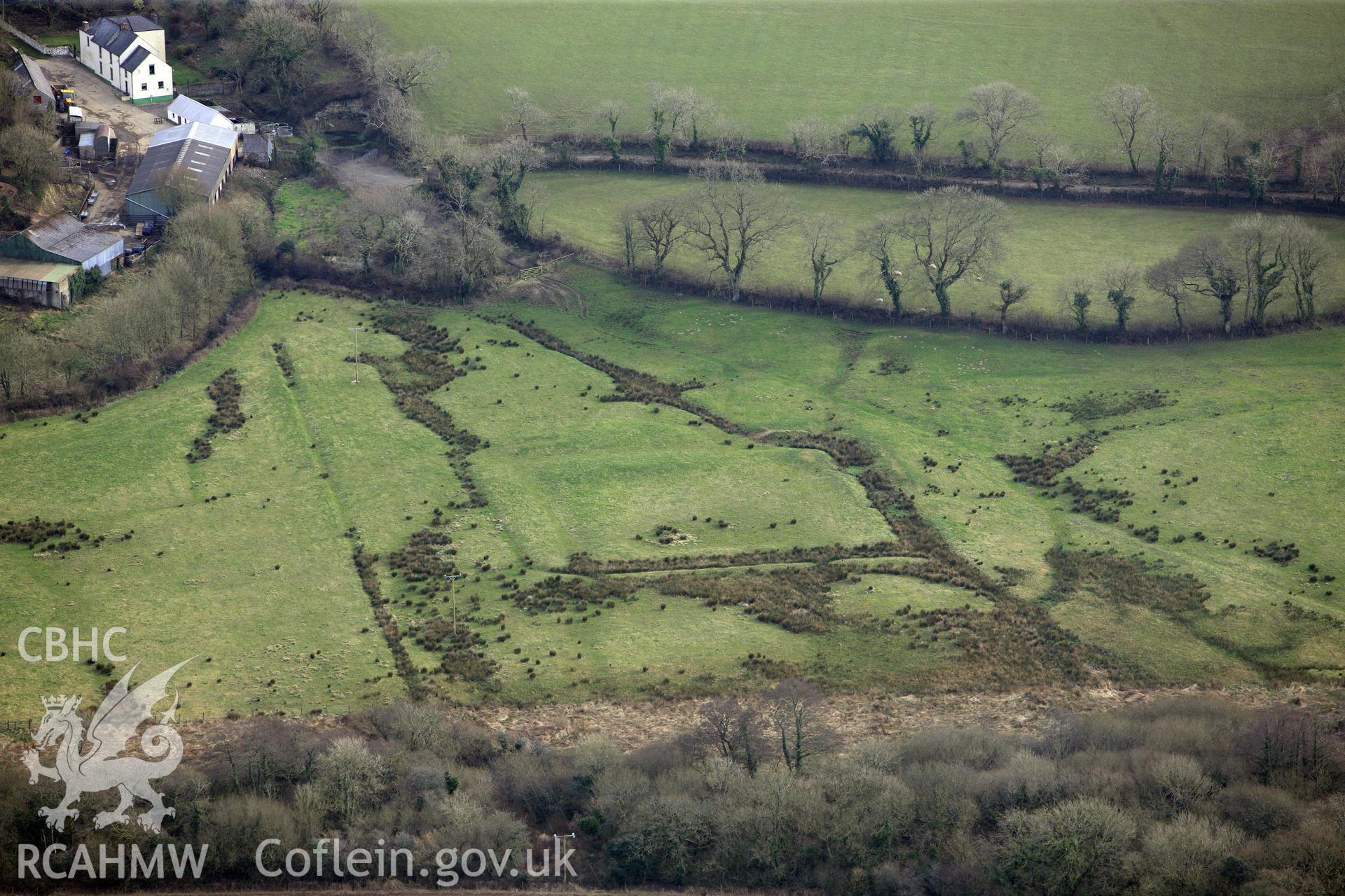 Merryborough moated site, north east of Haverfordwest. Oblique aerial photograph taken during the Royal Commission?s programme of archaeological aerial reconnaissance by Toby Driver on 28th February 2013.