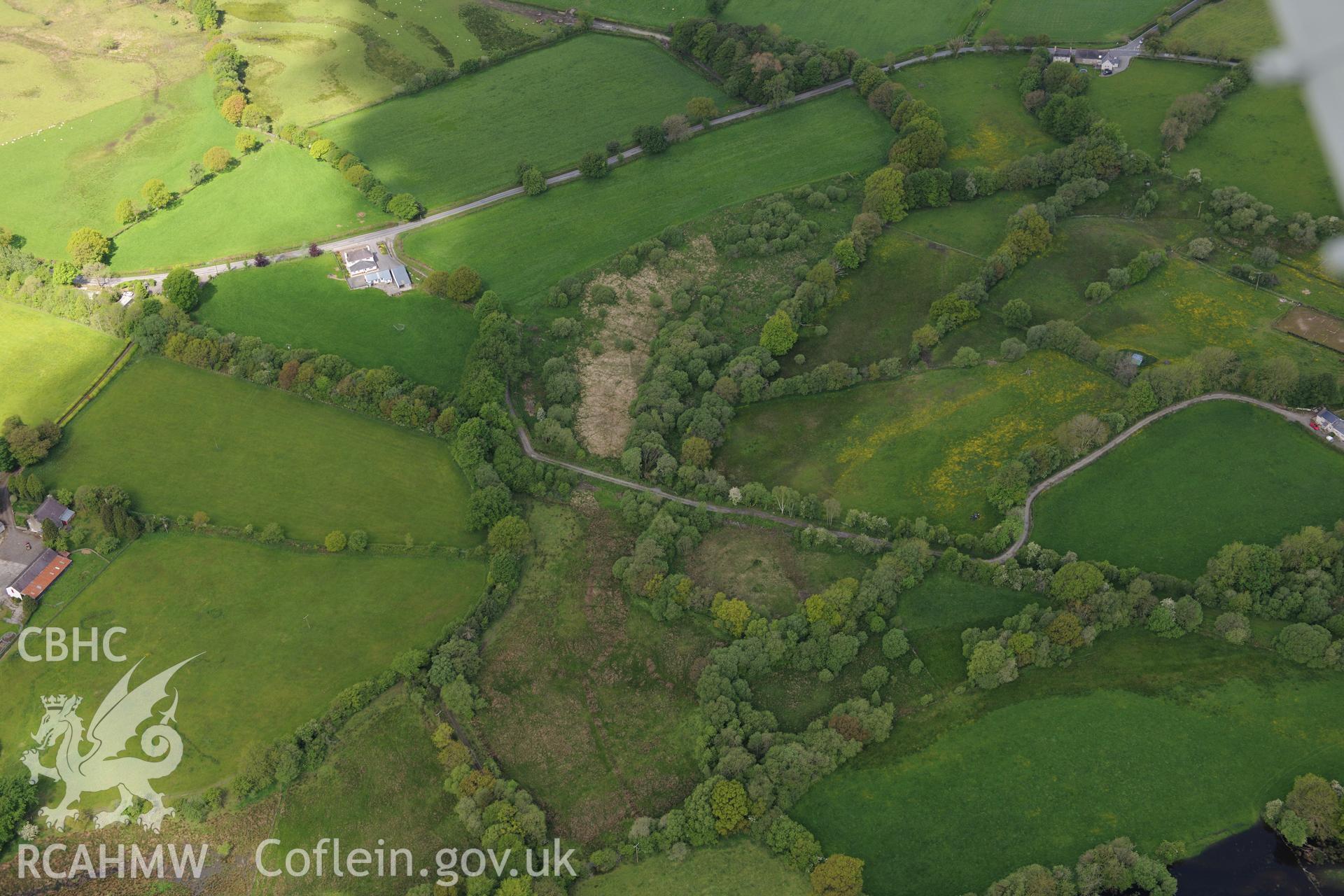 Findspot of Roman wooden head at Roman fort or settlement 'Bremia,' Llanio. Oblique aerial photograph taken during the Royal Commission's programme of archaeological aerial reconnaissance by Toby Driver on 3rd June 2015.