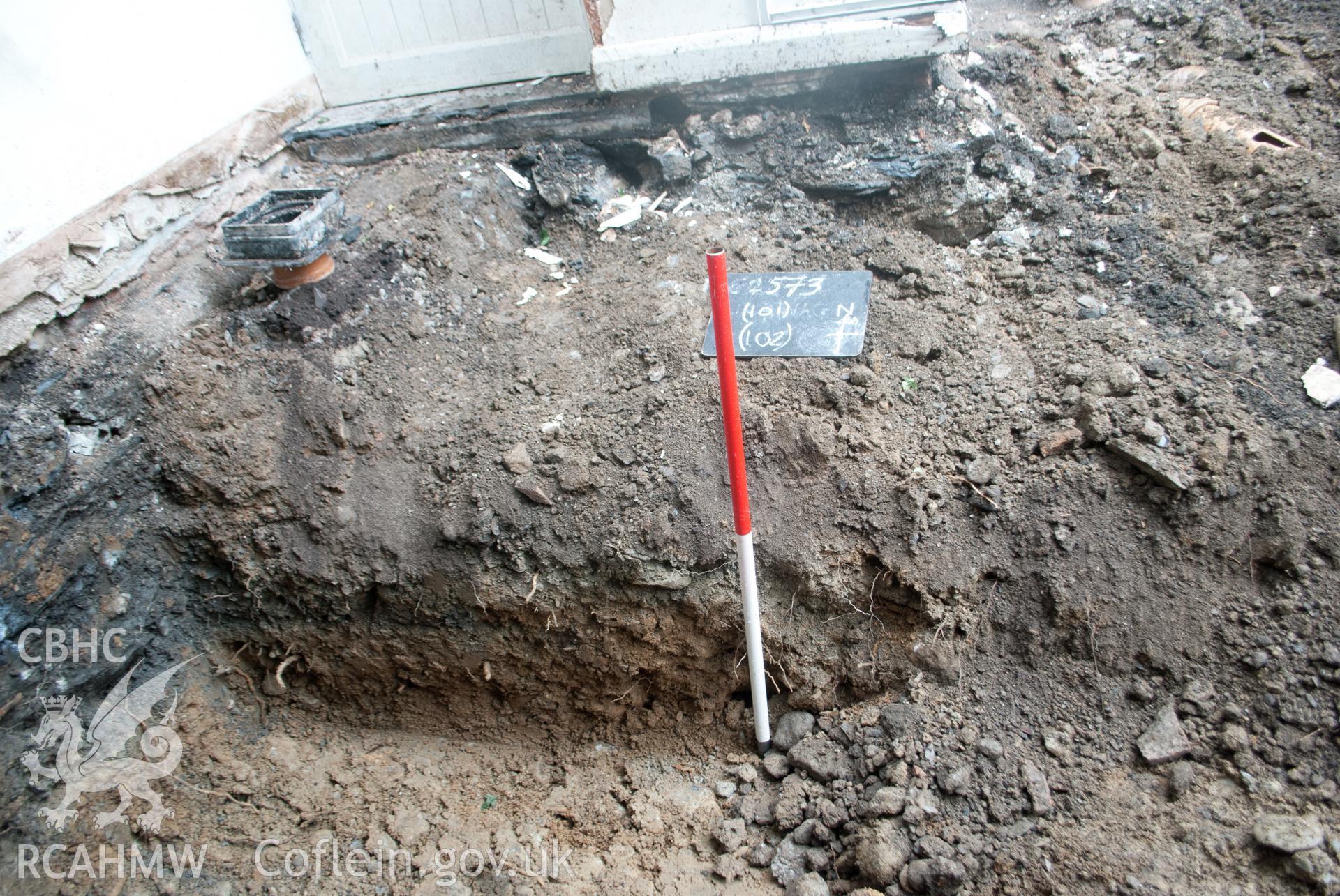 View from the south showing representative section of the south facing section of the foundation trench at Gwynle, Bala. Photographed during archaeological watching brief conducted by Gwynedd Archaeological Trust on 21 September 2018. Project no. G2573.