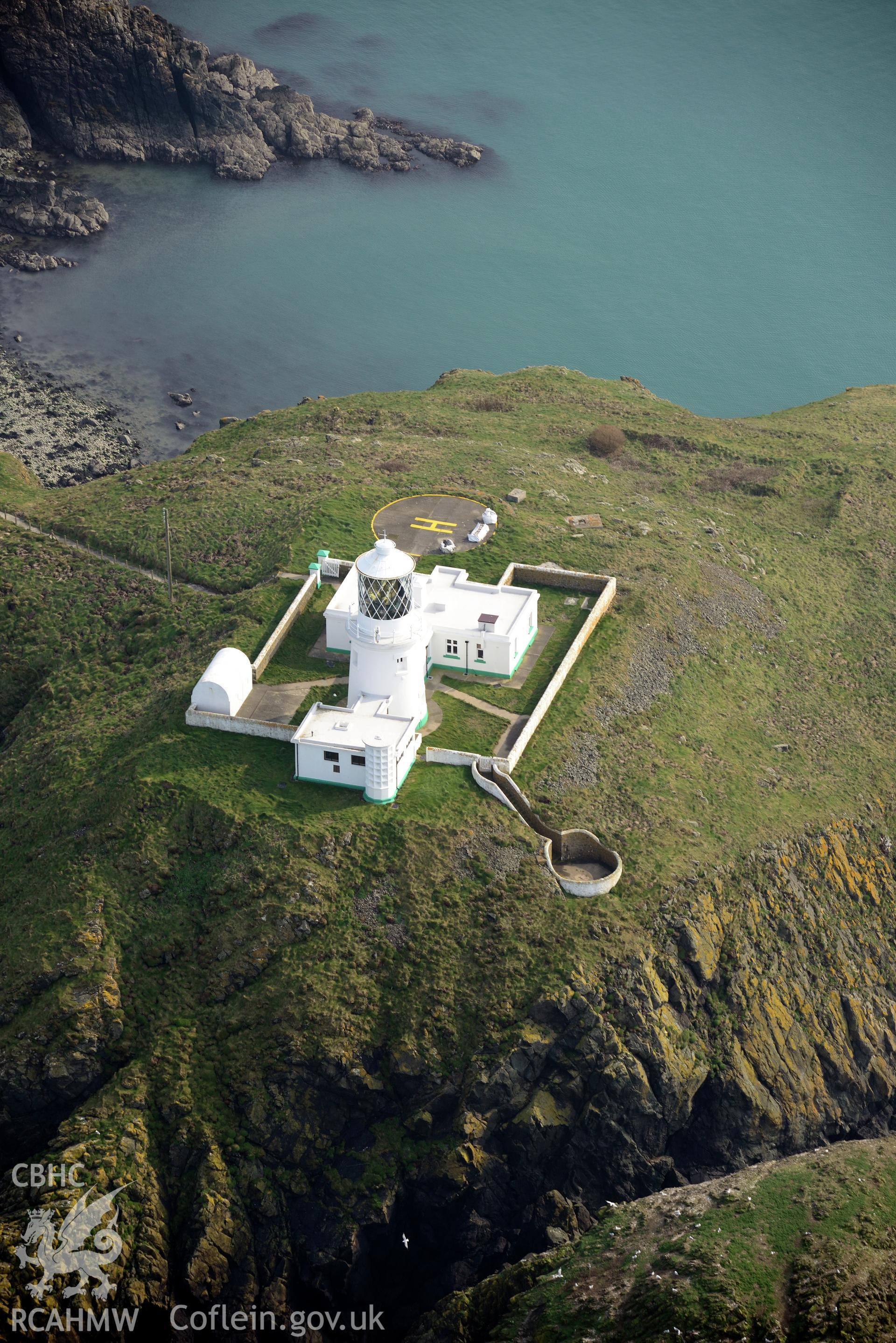 Aerial photography of Strumble Head lighthouse taken on 27th March 2017. Baseline aerial reconnaissance survey for the CHERISH Project. ? Crown: CHERISH PROJECT 2017. Produced with EU funds through the Ireland Wales Co-operation Programme 2014-2020. All material made freely available through the Open Government Licence.