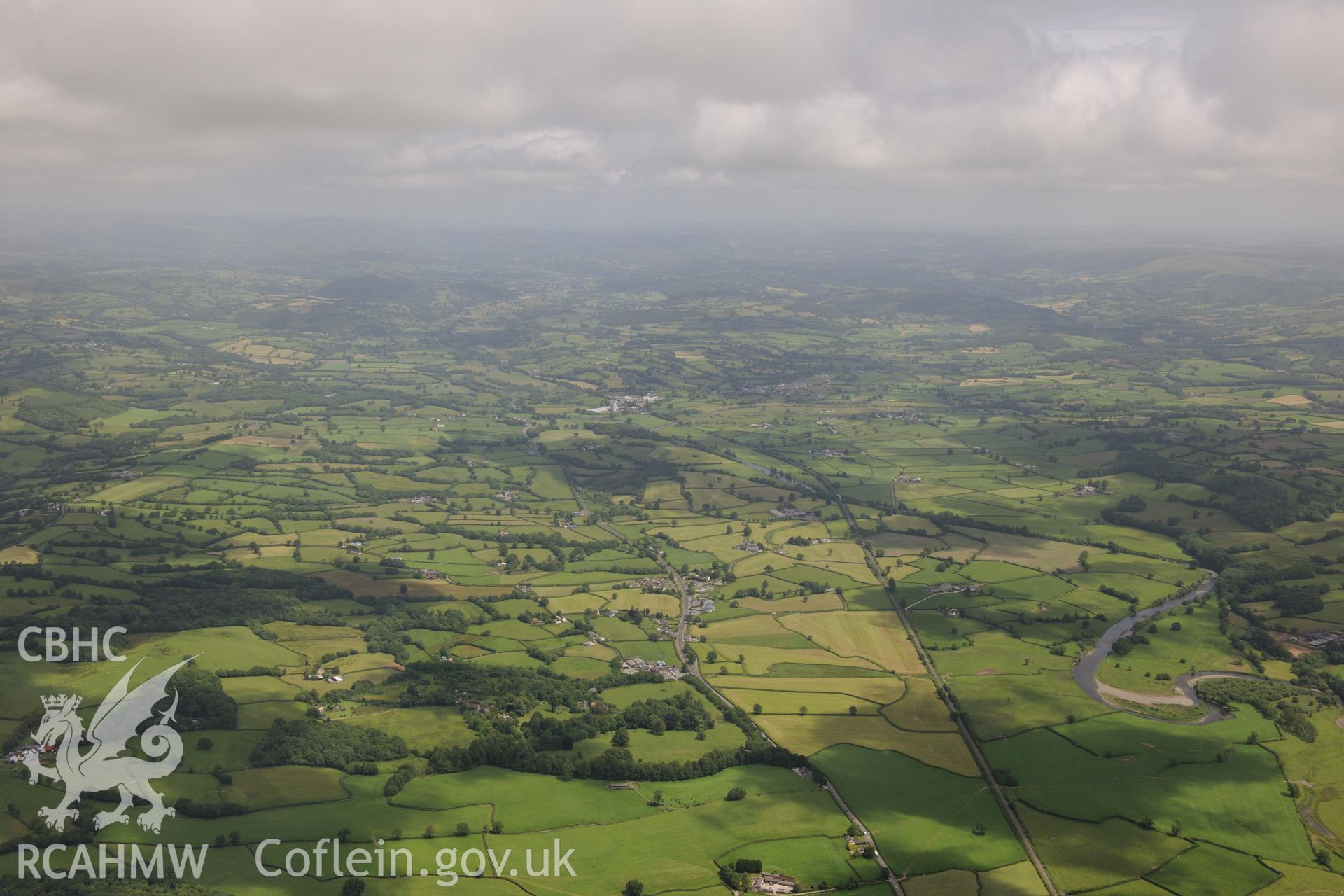 View looking north east up Towy valley. Manordeilo, River Towy, A40 road & Central Wales railway line visible. Oblique aerial photograph taken during the Royal Commission's programme of archaeological aerial reconnaissance by Toby Driver on 29/6/2015.