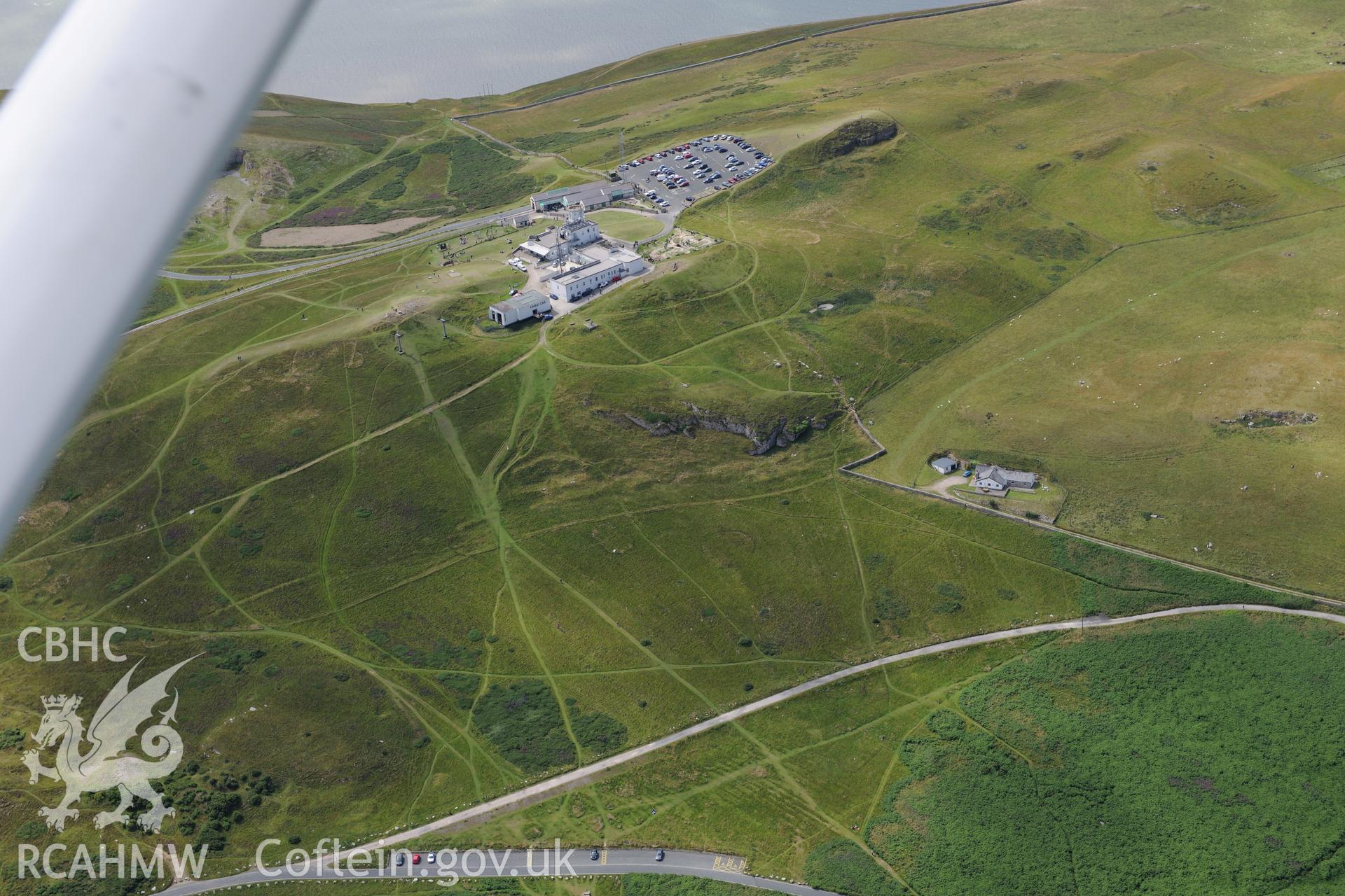 Great Orme, including views of a deserted rural settlement; ridge and furrow field system; visitor centre; telegraph station; telegraph hotel and White Farm. Oblique aerial photograph taken during the Royal Commission's programme of archaeological aerial reconnaissance by Toby Driver on 30th July 2015.