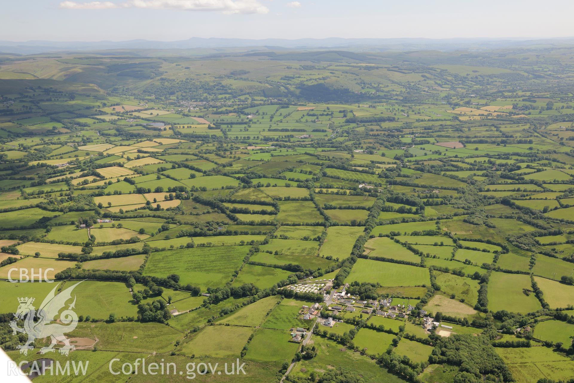 Section of Sarn Helen Roman Road running from Llanio-Isaf, through the hamlet of Stag's Head and up to Tyncelyn, near Tregaron. Oblique aerial photograph taken during the Royal Commission's programme of archaeological aerial reconnaissance by Toby Driver on 30th June 2015.