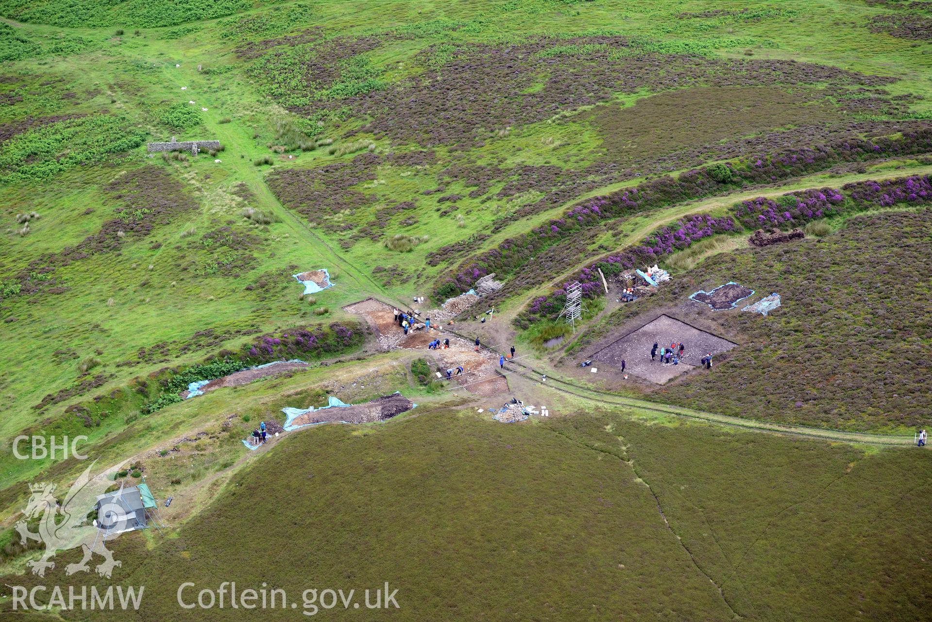 Penycloddiau Hilfort and Hut Platform V, Llangwyfan. Excavation by Liverpool University. Oblique aerial photograph taken during the Royal Commission's programme of archaeological aerial reconnaissance by Toby Driver on 30th July 2015.