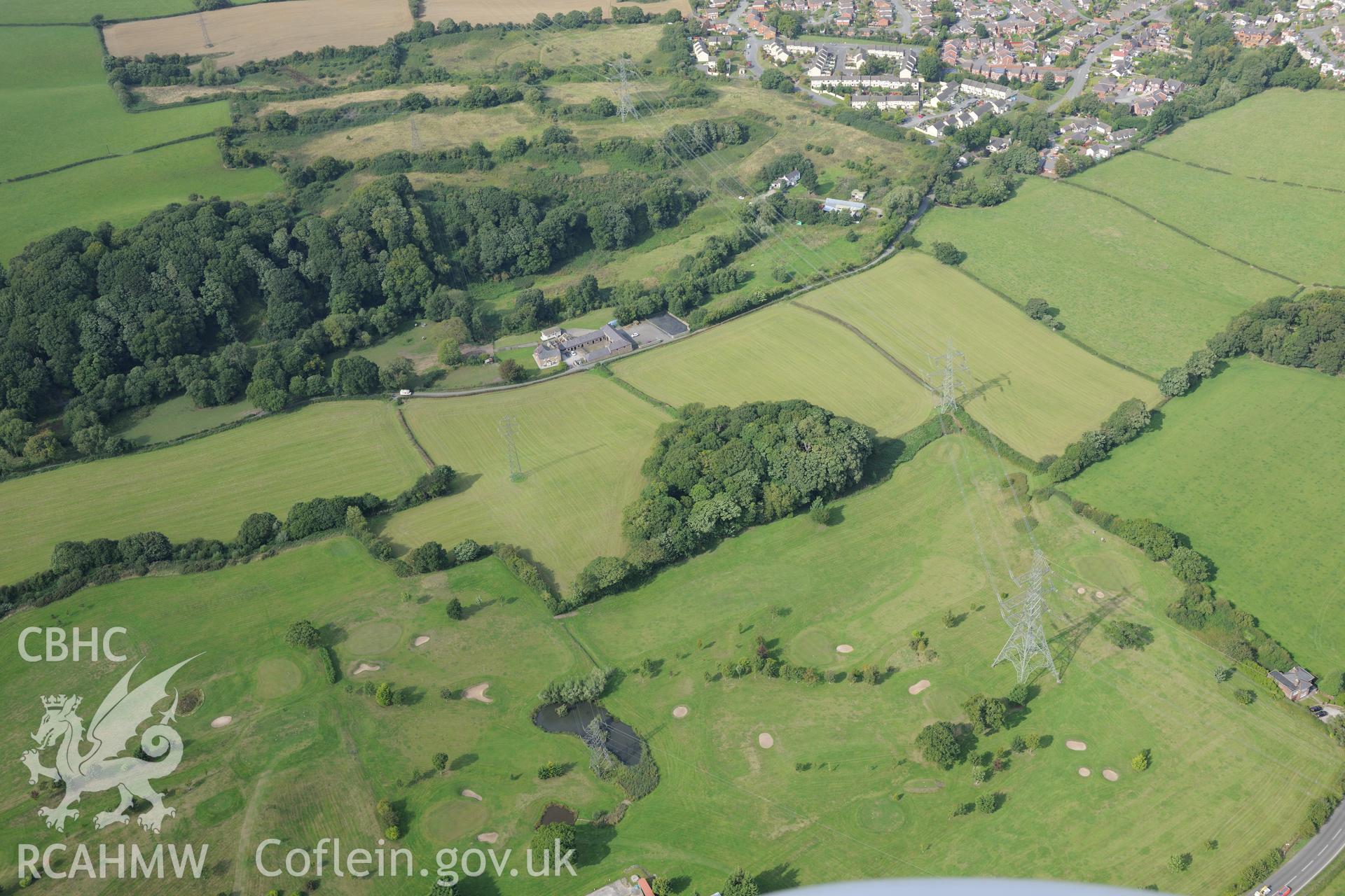 Bryn-y-Cwm motte, near Flint. Oblique aerial photograph taken during the Royal Commission's programme of archaeological aerial reconnaissance by Toby Driver on 11th September 2015.