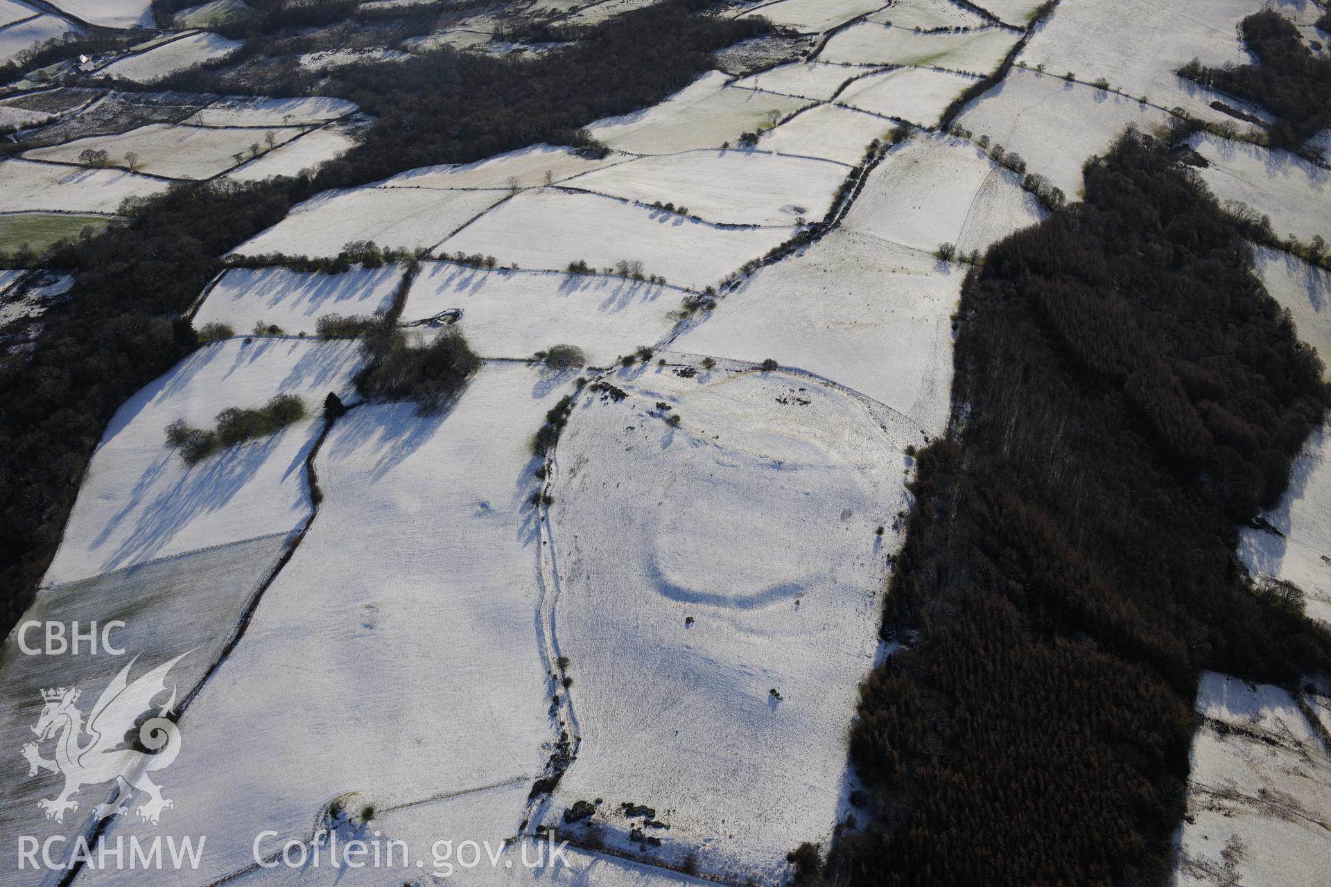 Twyn-y-Gaer enclosure, Defynnog, south east of Sennybridge. Oblique aerial photograph taken during the Royal Commission?s programme of archaeological aerial reconnaissance by Toby Driver on 15th January 2013.