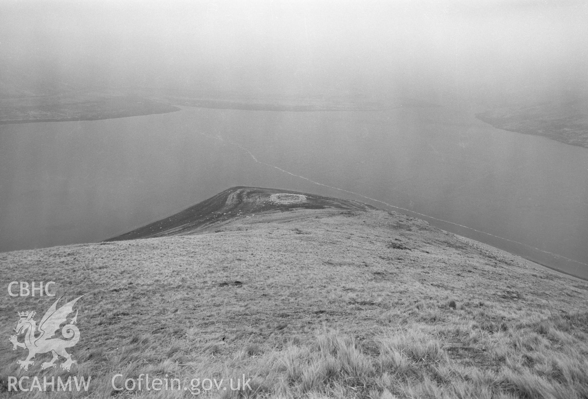 Digital copy of a black and white nitrate negative showing a view of Aber Camddwr cairn, taken by RCAHMW, undated.