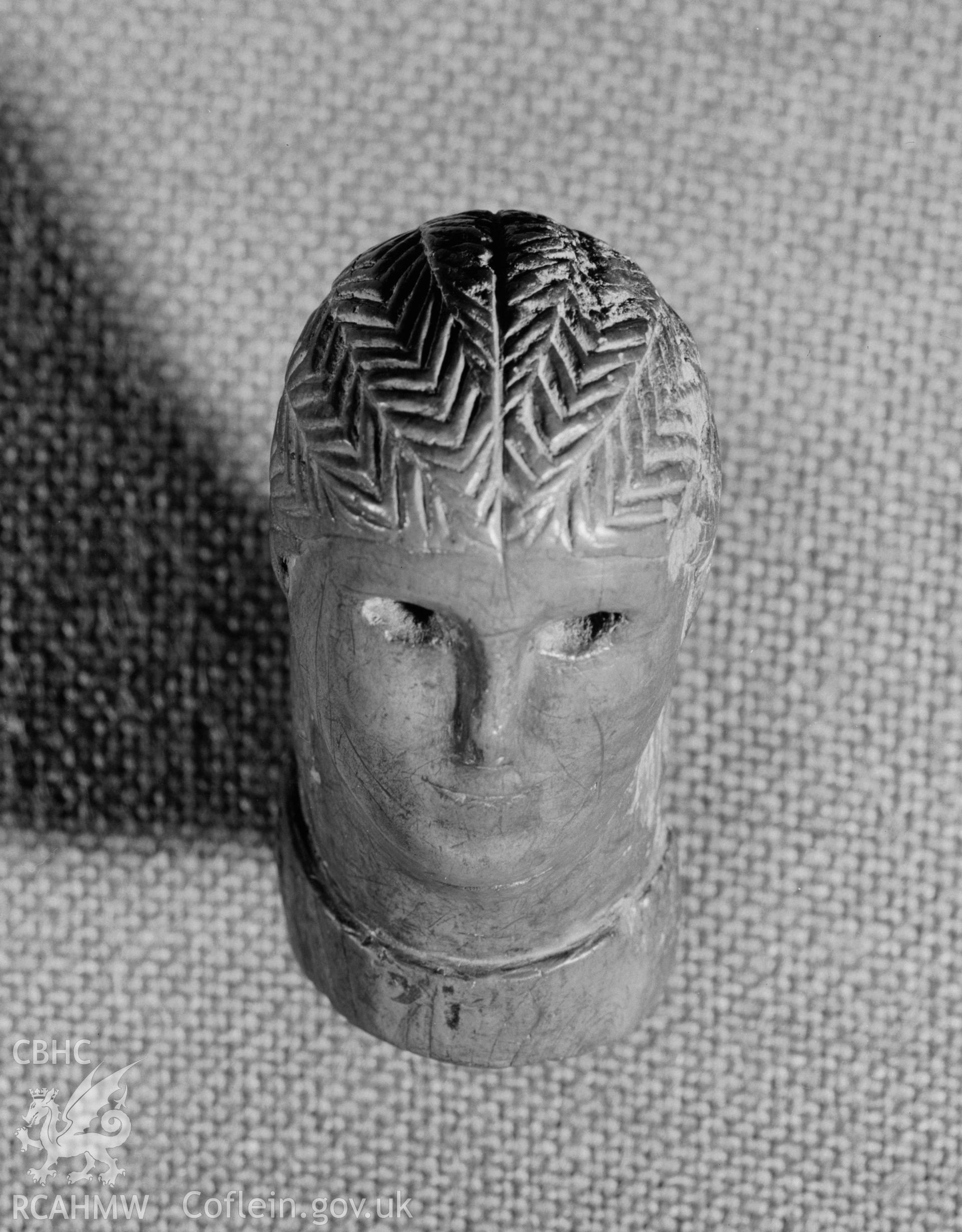 View of carved wooden head from Llanio Roman Fort.