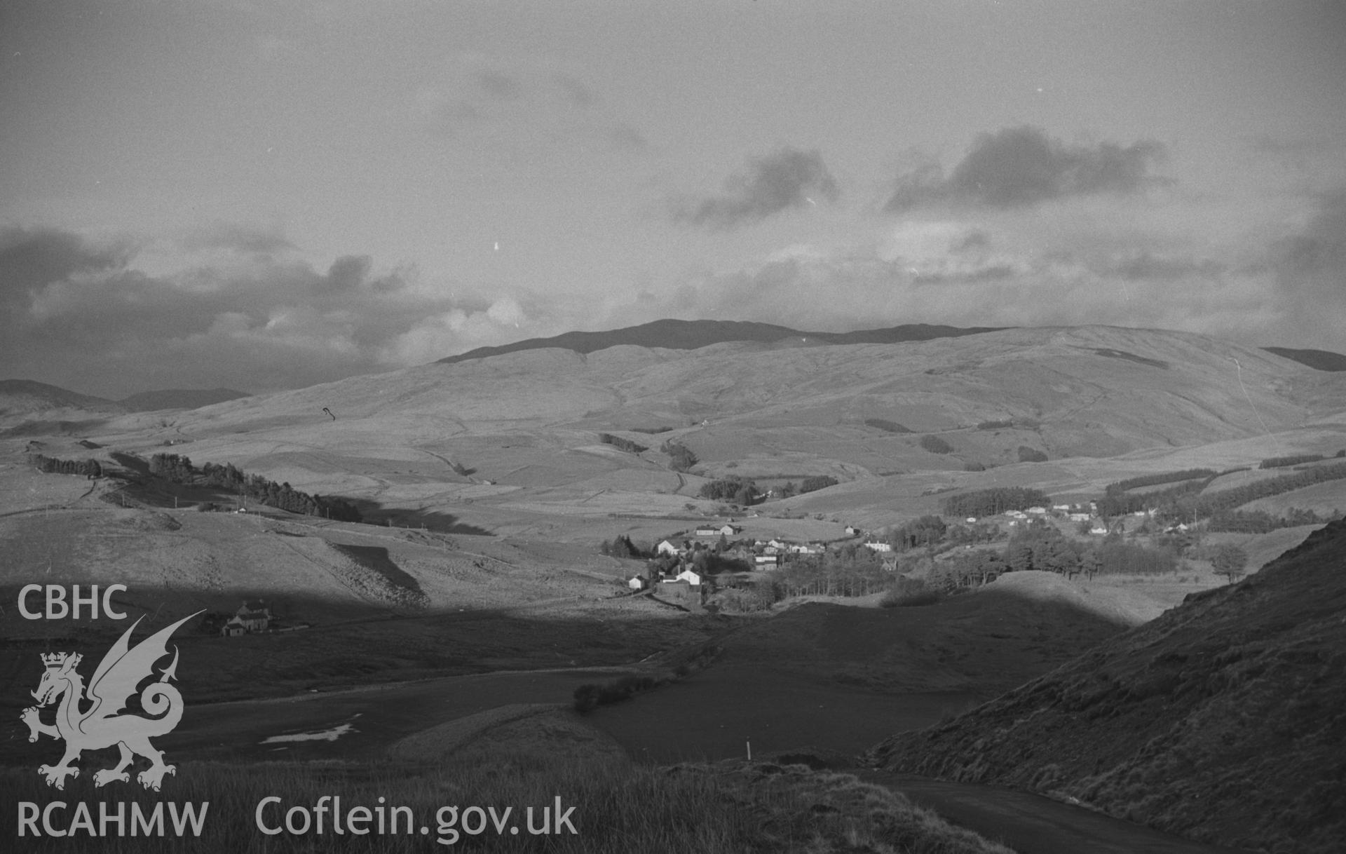 Digital copy of a black and white negative showing Ponterwyd and Plynlimon from the Ystumtuen road at the north end of the Hen Rhiw. Photographed by Arthur O. Chater in January 1968. (Looking north east from Grid Reference SN 742 799).