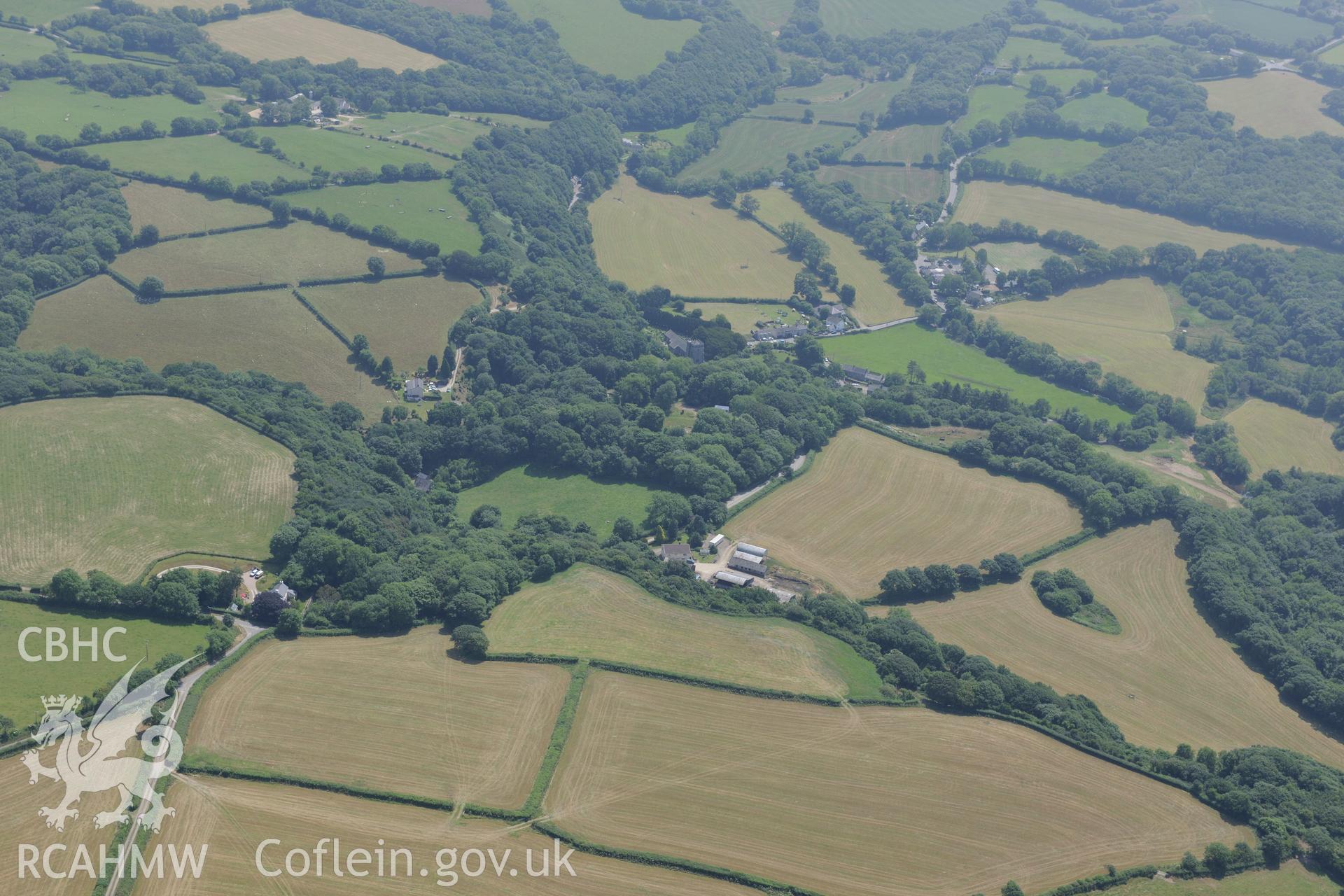 St Brynach's church and Nevern castle, Nevern, south west of Cardigan. Oblique aerial photograph taken during the Royal Commission?s programme of archaeological aerial reconnaissance by Toby Driver on 12th July 2013.