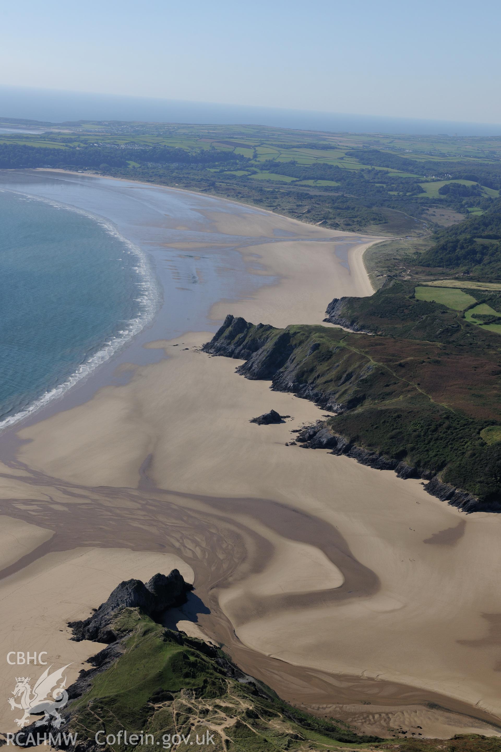 Castle Tower and Three Cliffs Bay landing point, on the southern coast of the Gower Peninsula. Oblique aerial photograph taken during the Royal Commission's programme of archaeological aerial reconnaissance by Toby Driver on 30th September 2015.