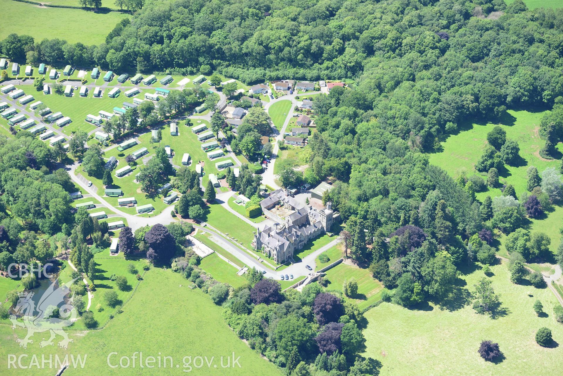 Mellington Hall, it's garden and the section of Offa's Dyke that runs through its grounds. Oblique aerial photograph taken during the Royal Commission's programme of archaeological aerial reconnaissance by Toby Driver on 30th June 2015.