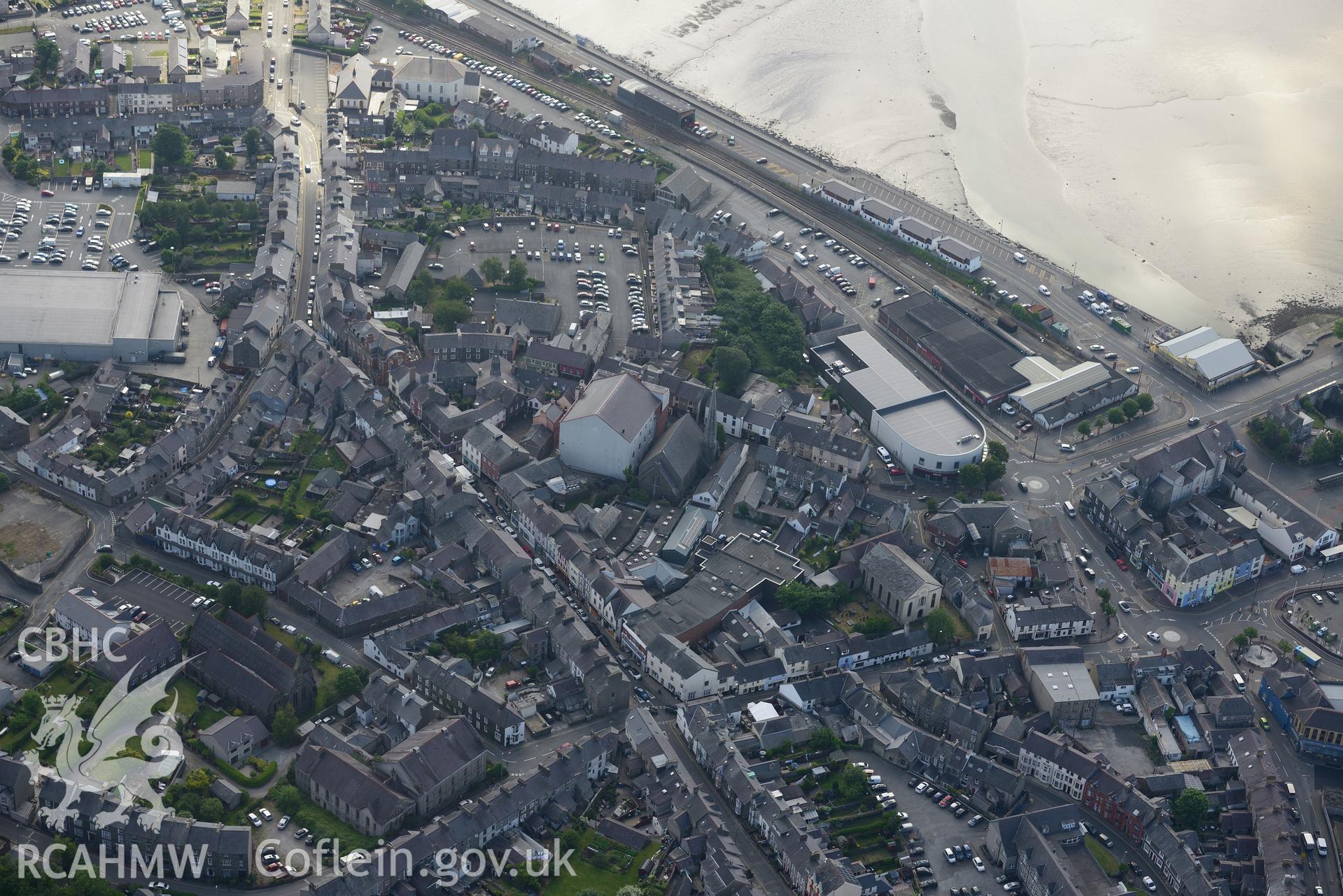 Pen-Lan and Salem chapels; St Peter's Church; old Town Hall; new Town Hall (cinema) & railway station, Pwllheli. Oblique aerial photograph taken during the Royal Commission's programme of archaeological aerial reconnaissance by Toby Driver on 23/06/2015.