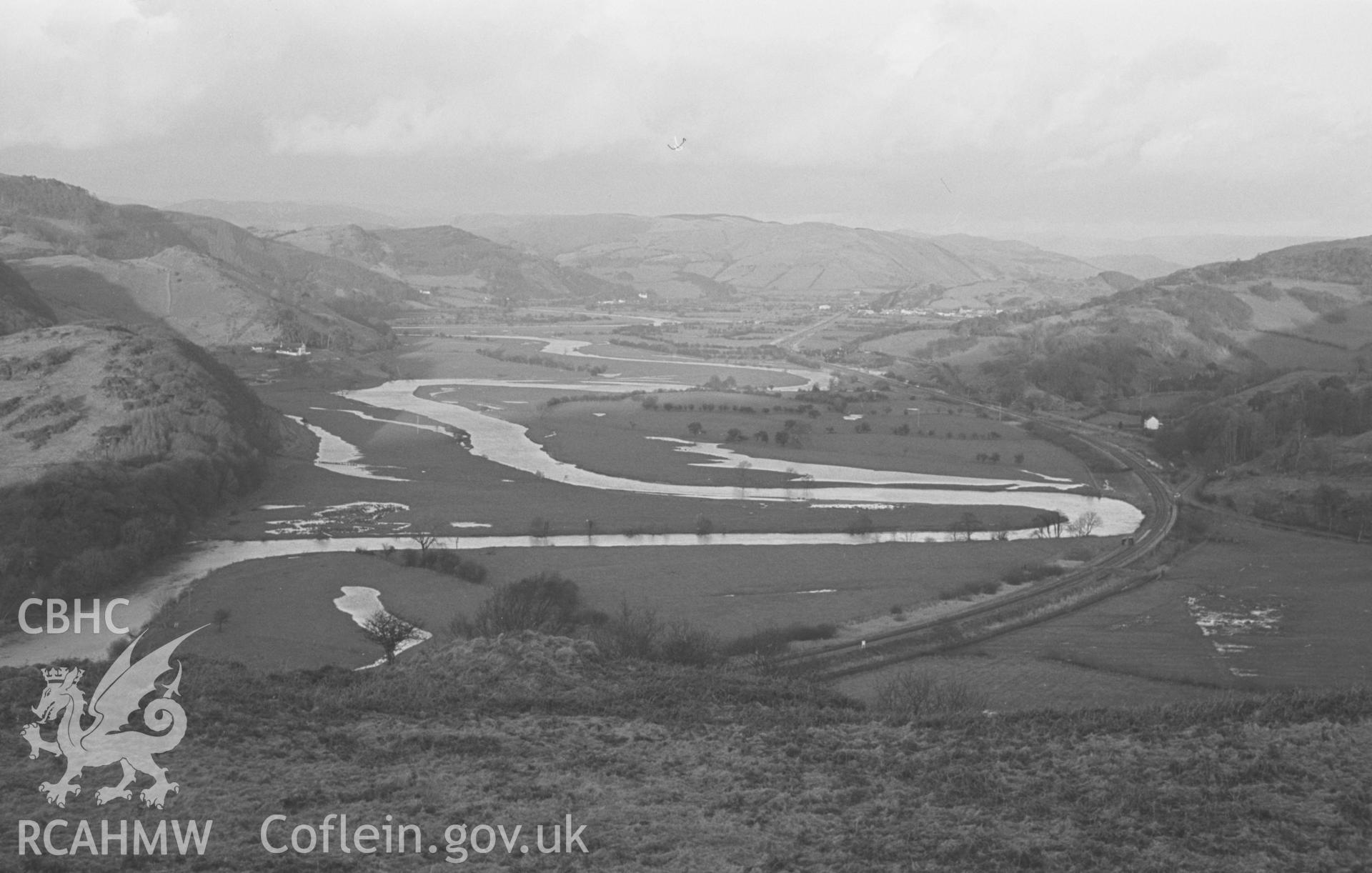 Digital copy of a black and white negative showing view of Machynlleth and the Afon Dyfi from the west. Photographed by Arthur O. Chater on 31st December 1966.