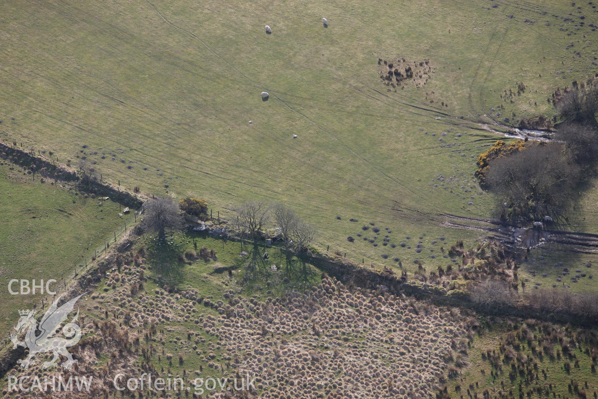 RCAHMW colour oblique aerial photograph of Cerrig Llwydion Chambered Tomb. Taken on 13 April 2010 by Toby Driver