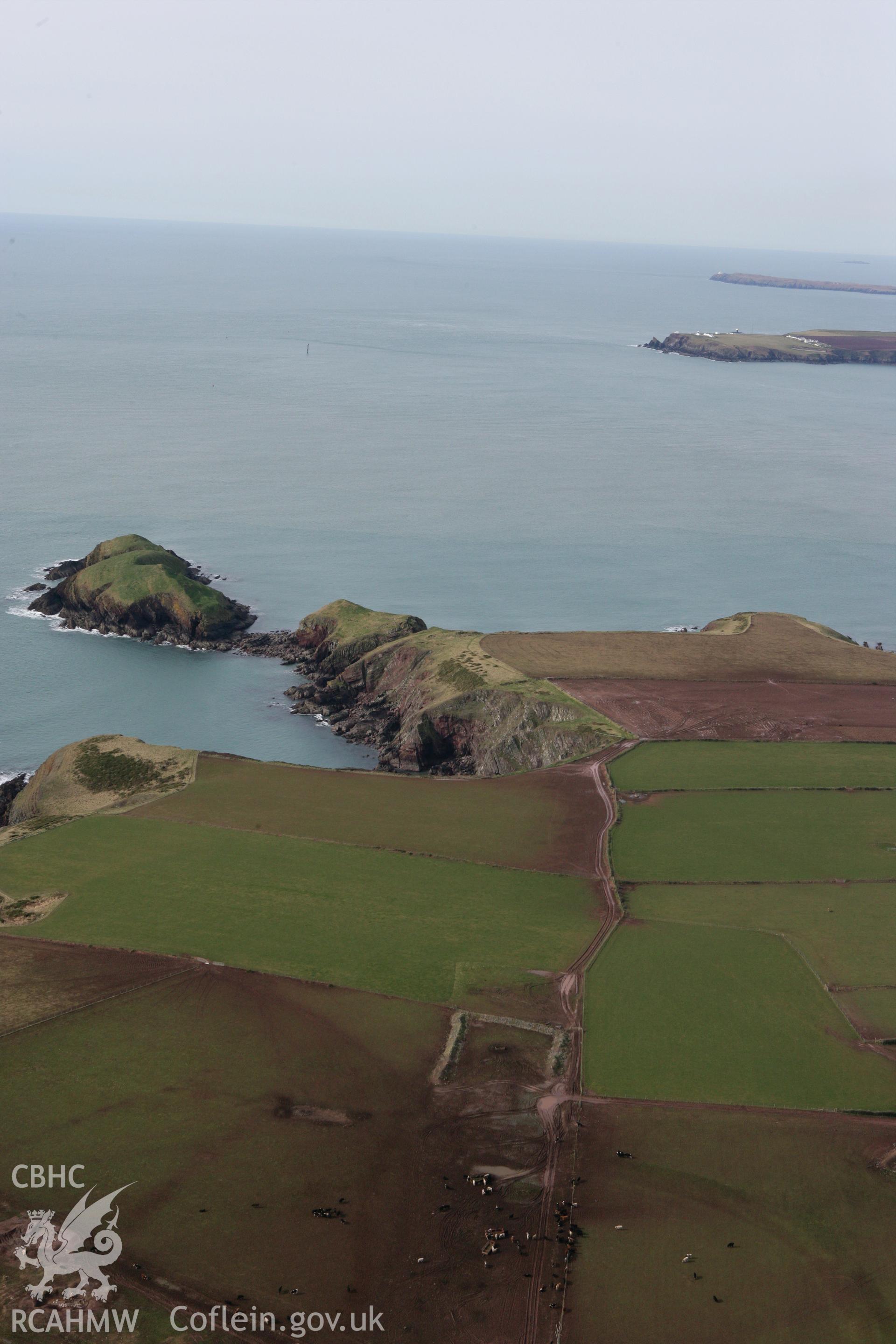 RCAHMW colour oblique aerial photograph of Sheep Island Promontory Fort. Taken on 02 March 2010 by Toby Driver