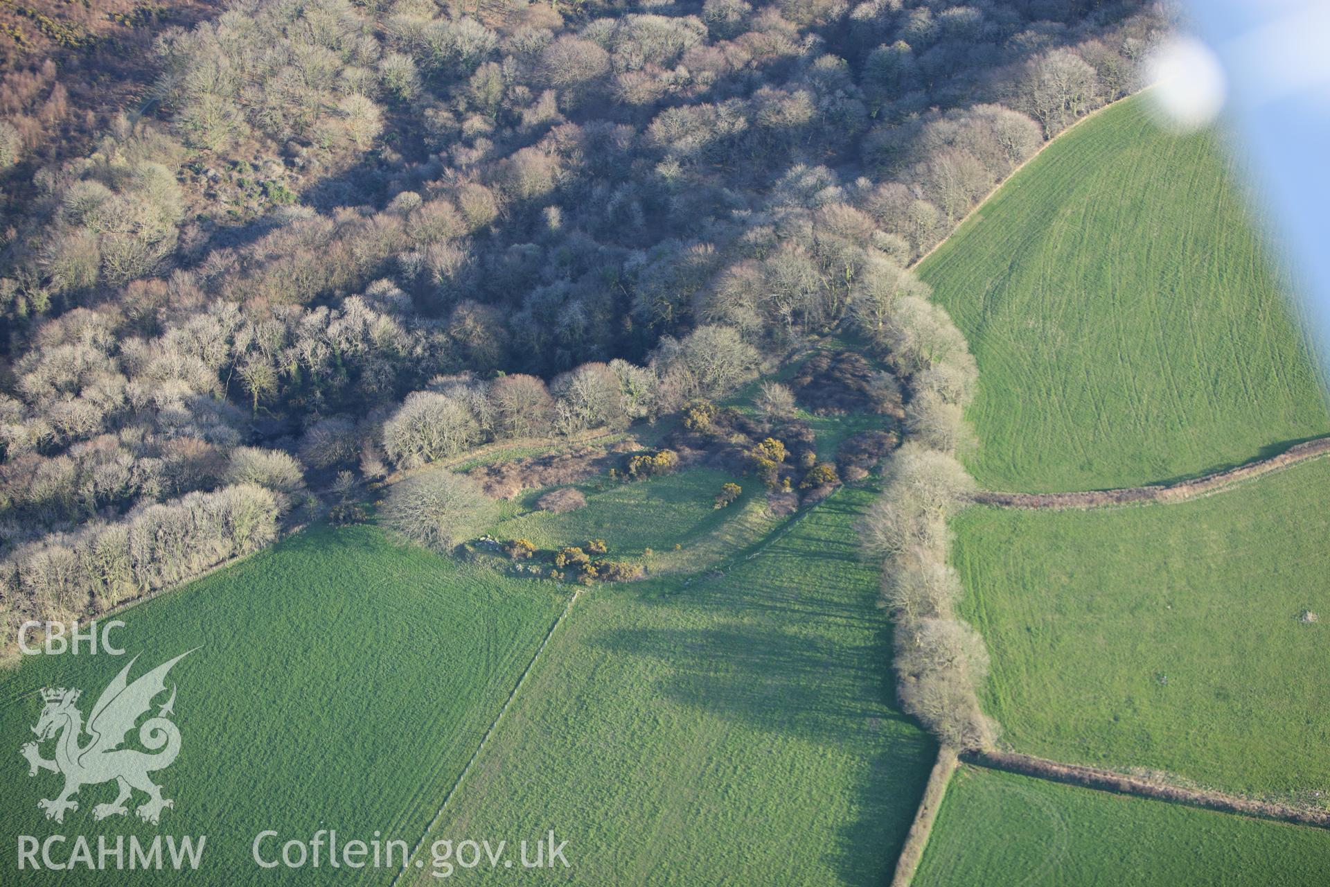 RCAHMW colour oblique aerial photograph of Sealyham Quarries Enclosure. Taken on 13 April 2010 by Toby Driver