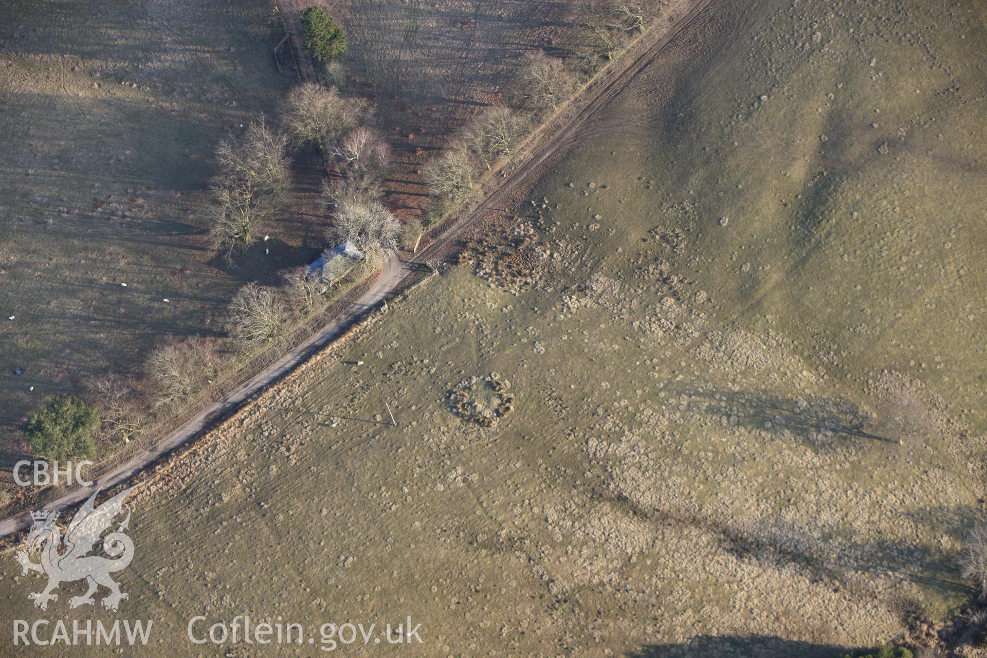 RCAHMW colour oblique photograph of Pant Purlas Round Barrow. Taken by Toby Driver on 11/03/2010.