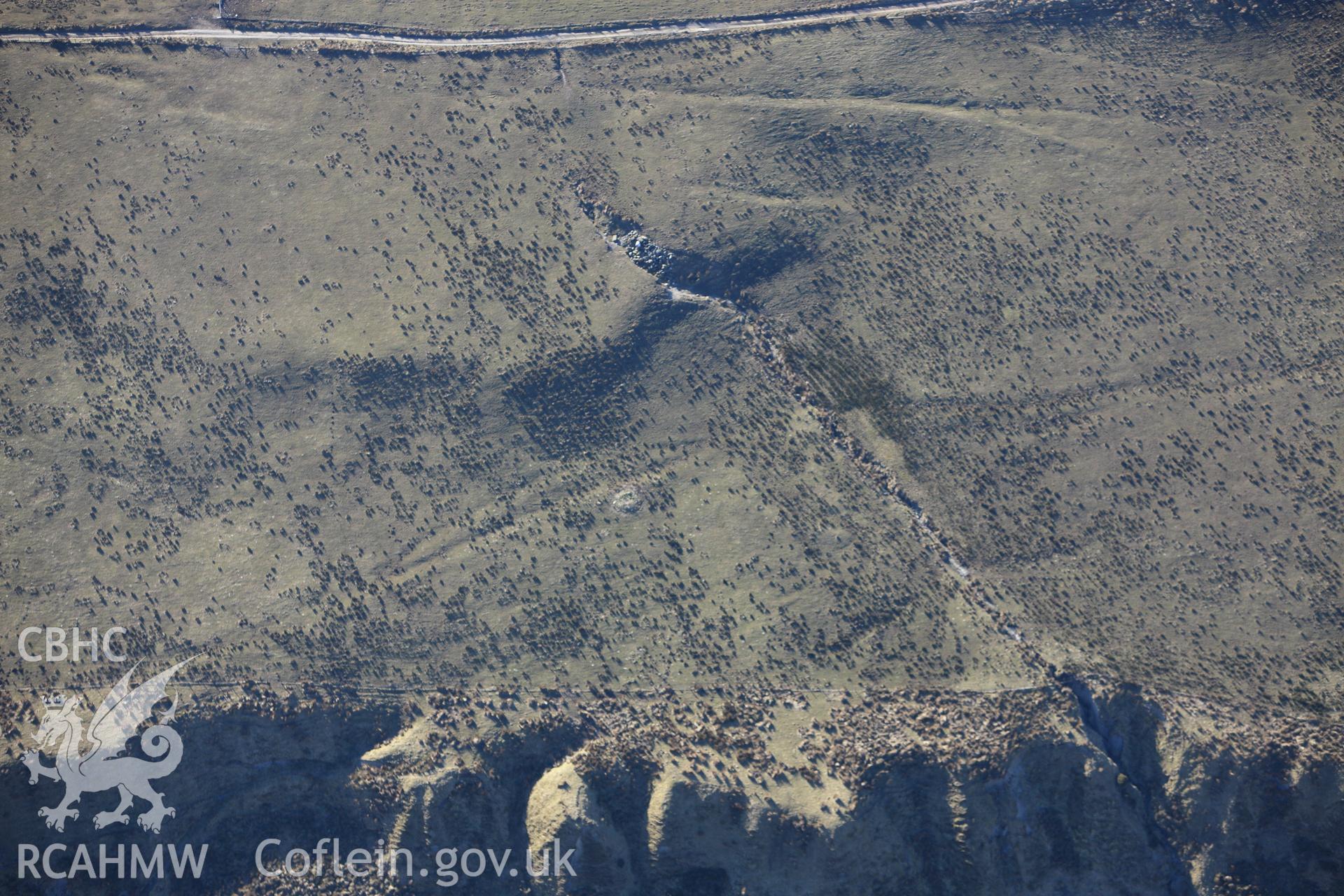 RCAHMW colour oblique photograph of Cae'r Arglwyddes east cairn. Taken by Toby Driver on 08/03/2010.