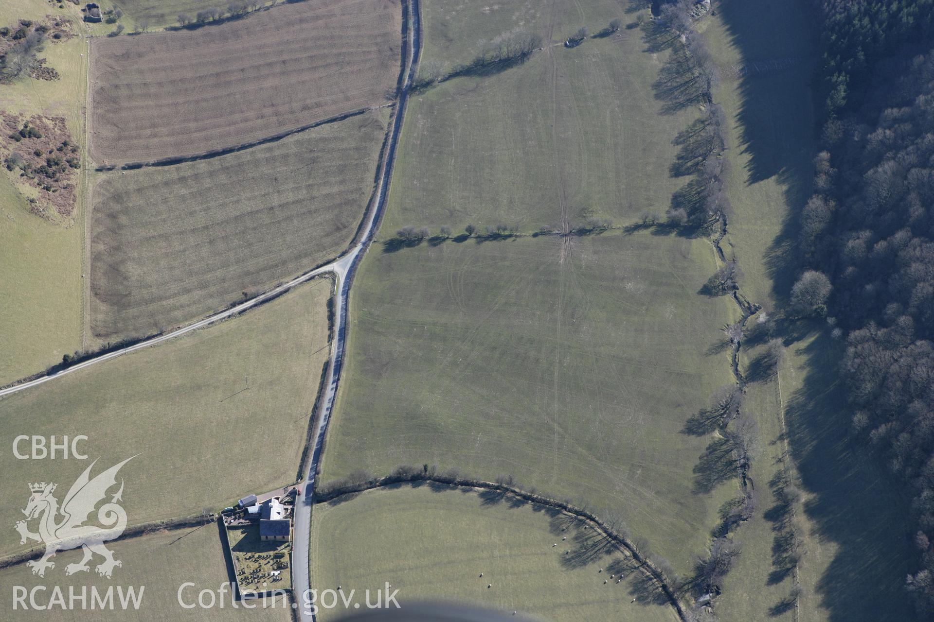 RCAHMW colour oblique photograph of Dyffryn Gwyn (Capel Maethon) round barrow. Taken by Toby Driver on 08/03/2010.