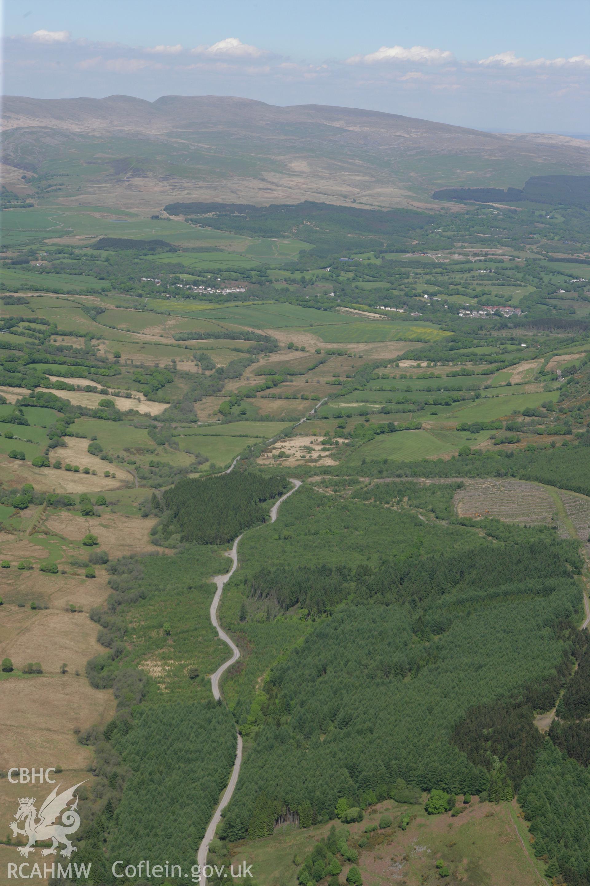 RCAHMW colour oblique photograph of landscape to the west of Mynydd Allt-y-Grug. Taken by Toby Driver on 24/05/2010.