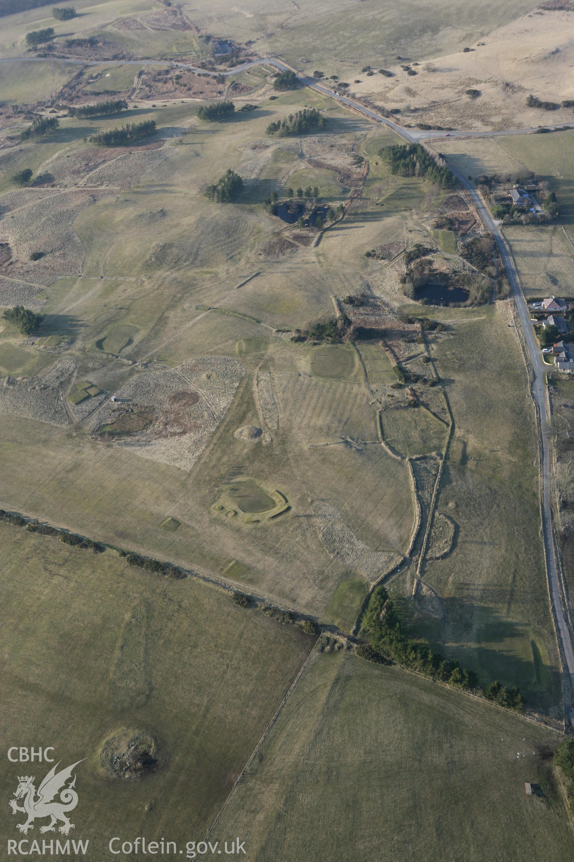 RCAHMW colour oblique photograph of Little Hill Cairn II and Earthworks. Taken by Toby Driver on 11/03/2010.