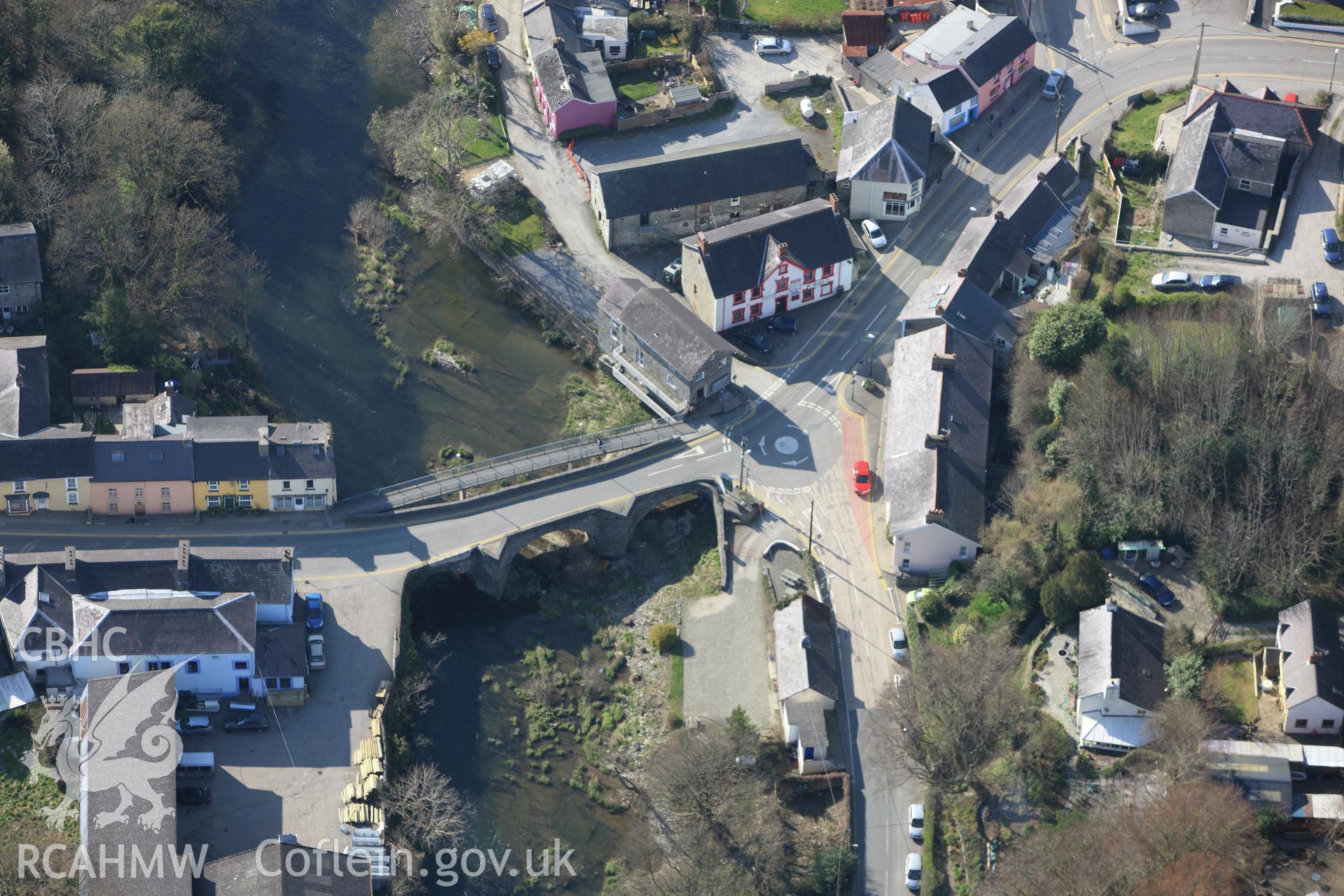 RCAHMW colour oblique aerial photograph of Newcastle Emlyn Bridge. Taken on 13 April 2010 by Toby Driver