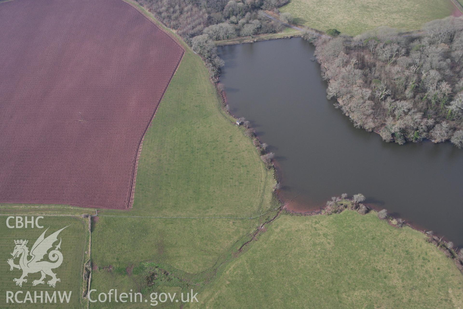 RCAHMW colour oblique aerial photograph of Orielton Home Farm Barrow II. Taken on 02 March 2010 by Toby Driver