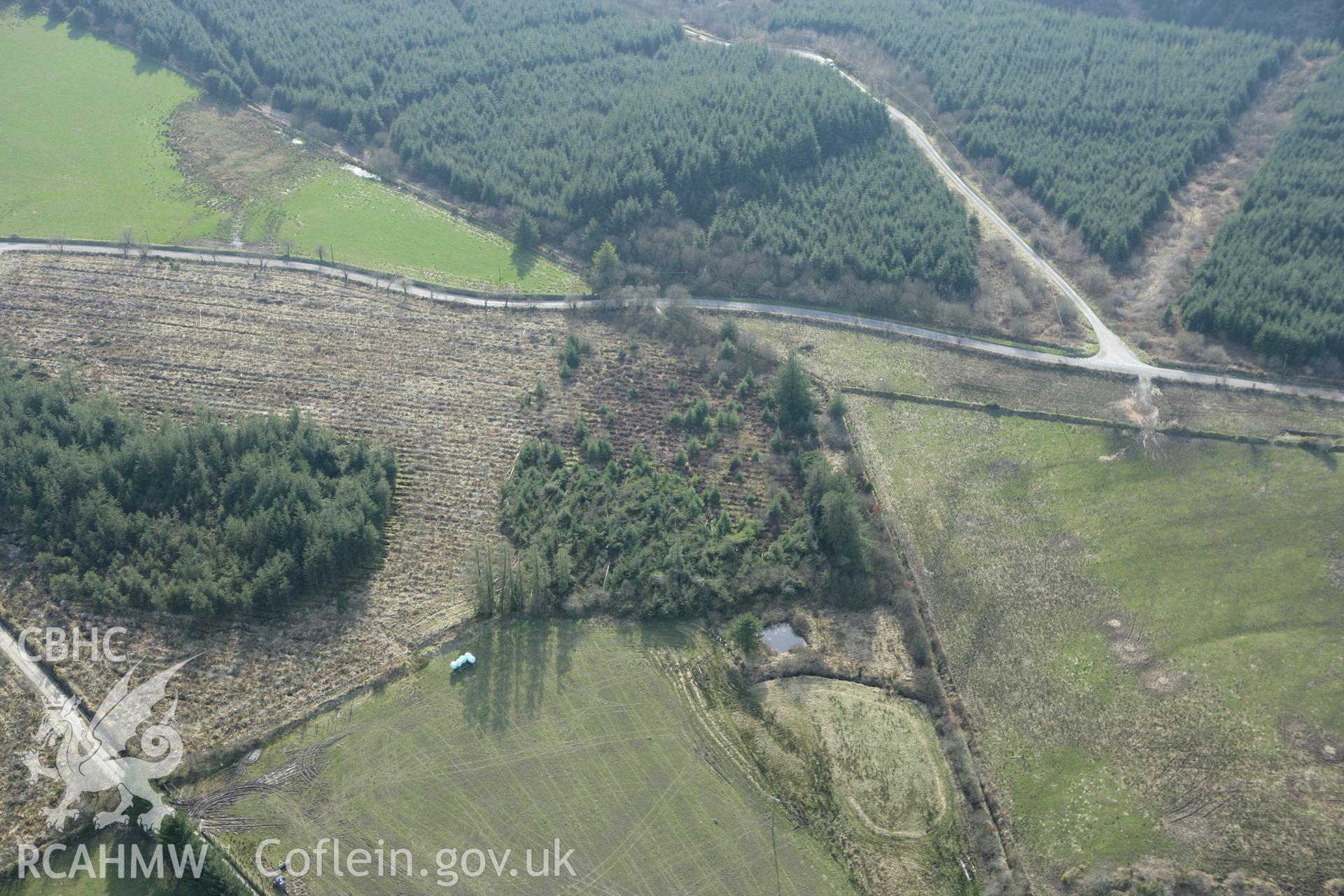 RCAHMW colour oblique aerial photograph of Crug Gilfach Fach. Taken on 13 April 2010 by Toby Driver