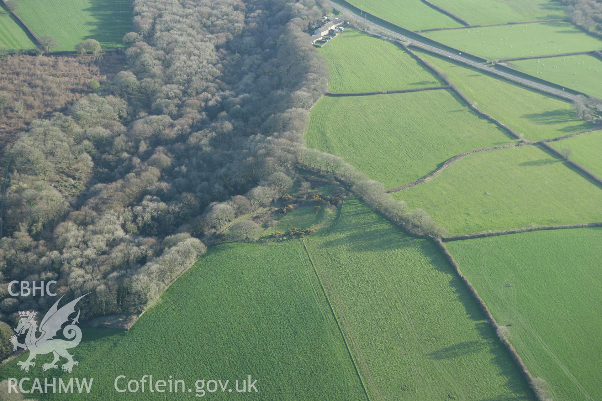 RCAHMW colour oblique aerial photograph of Sealyham Quarries Enclosure. Taken on 13 April 2010 by Toby Driver