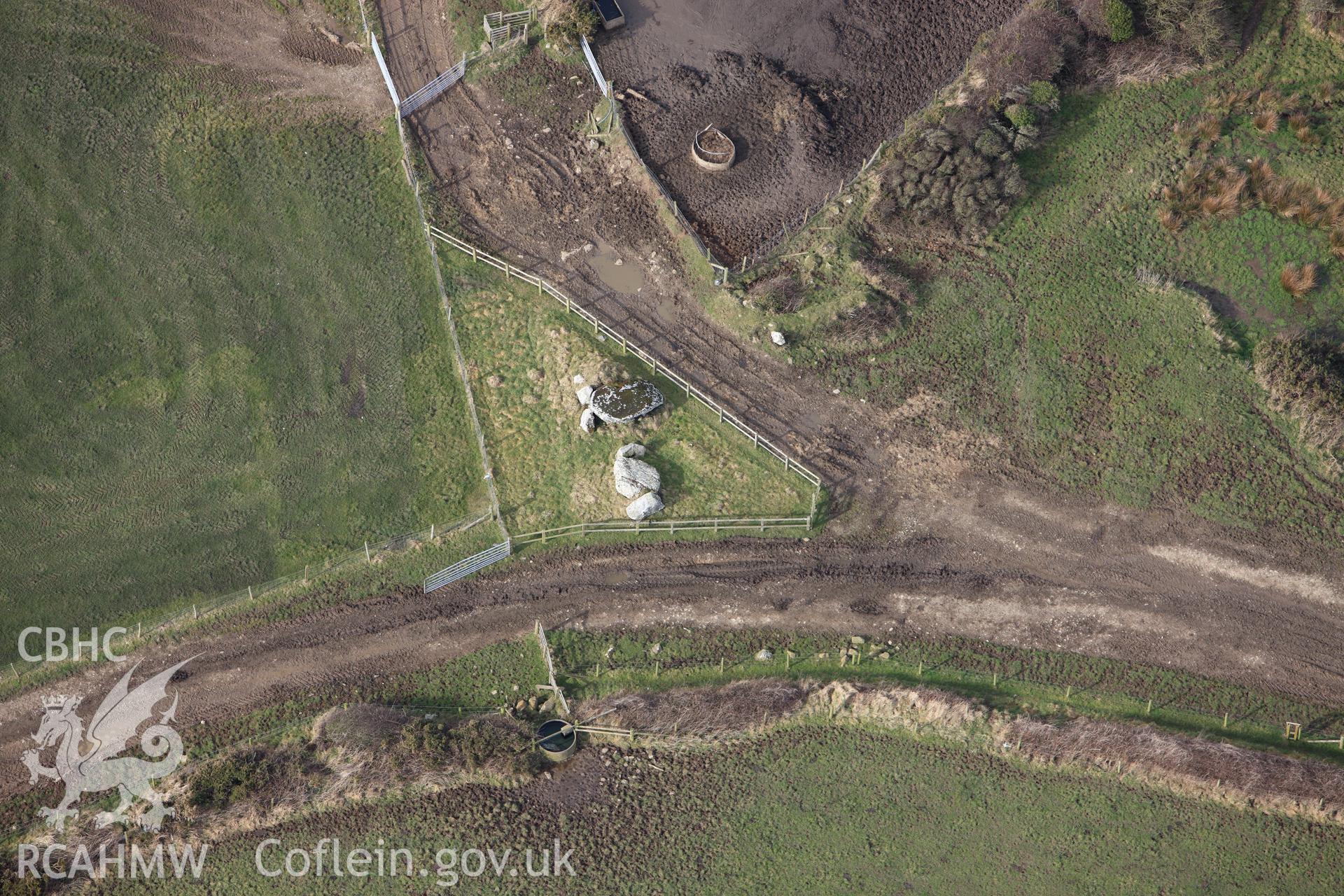 RCAHMW colour oblique aerial photograph of St Elvis Farm Burial Chambers. Taken on 02 March 2010 by Toby Driver