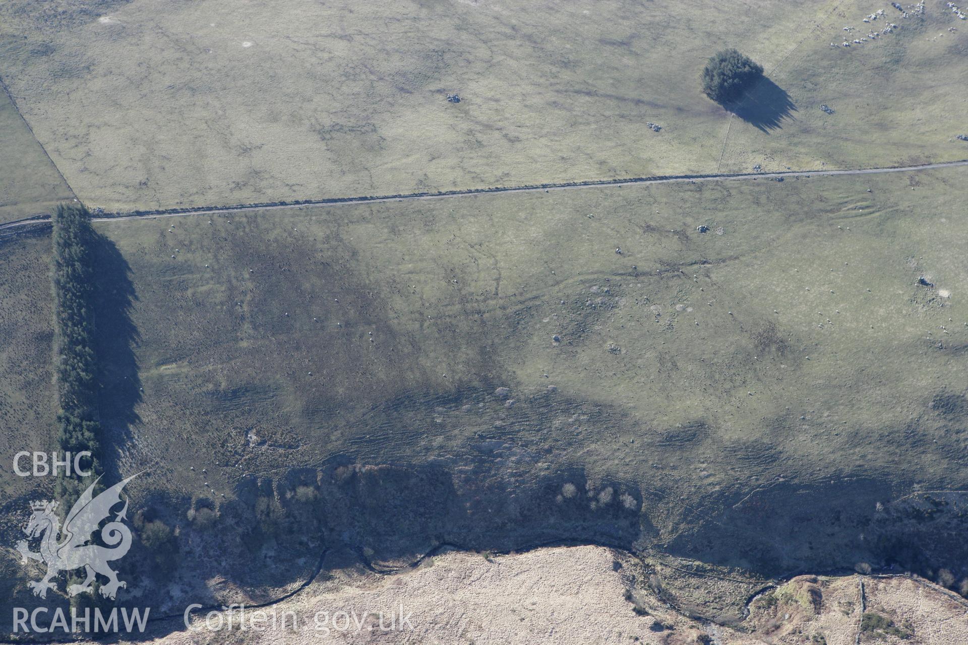 RCAHMW colour oblique photograph of Cae'r Arglwydd west cairn. Taken by Toby Driver on 08/03/2010.