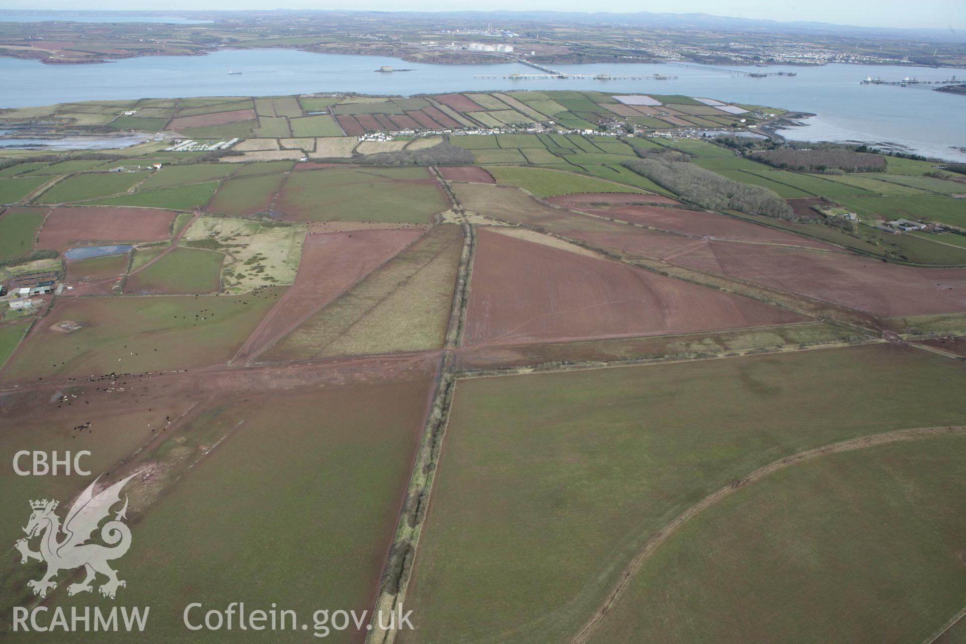 RCAHMW colour oblique aerial photograph of Angle Airfield. Taken on 02 March 2010 by Toby Driver