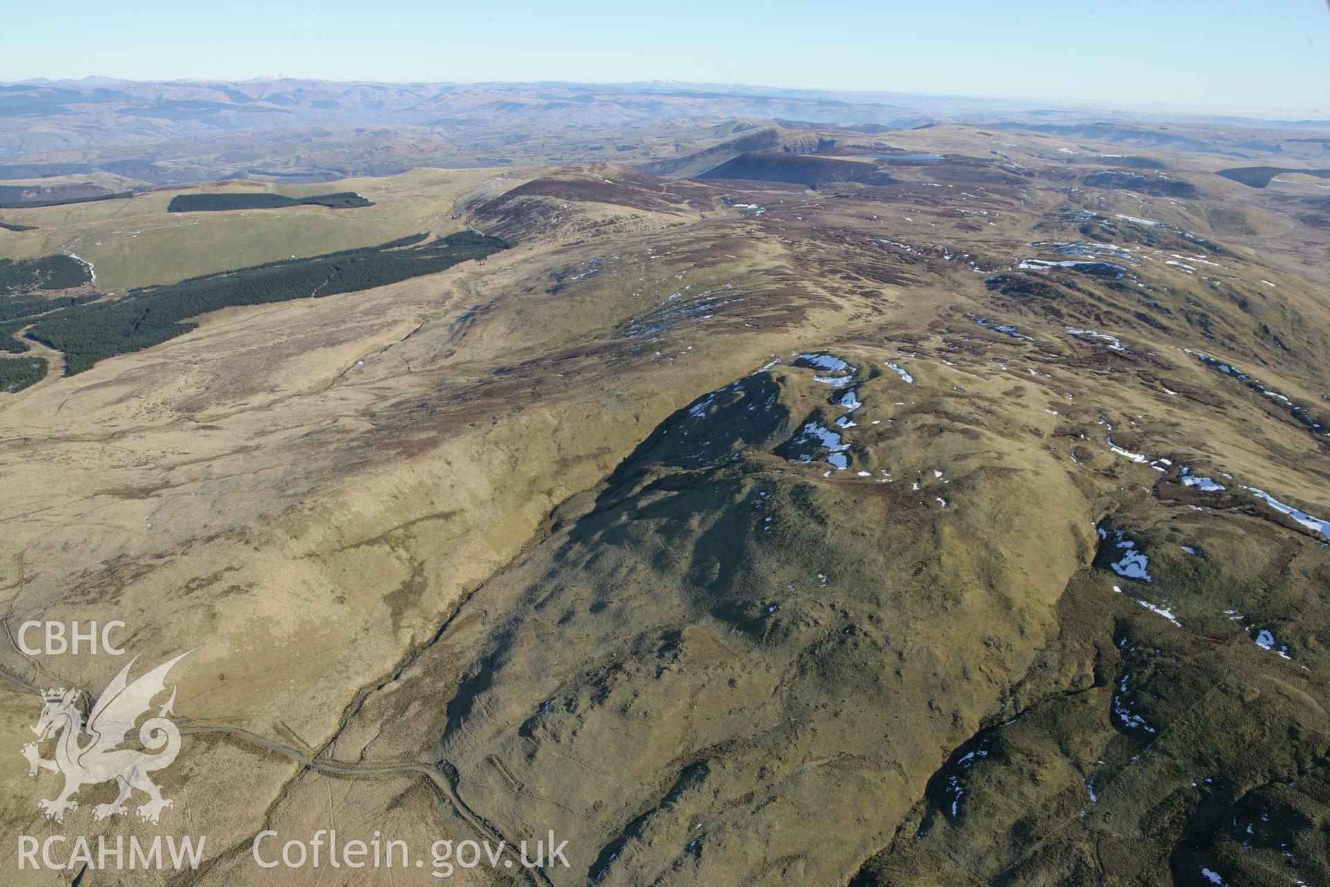 RCAHMW colour oblique photograph of Carn Gwilyn round cairns. Taken by Toby Driver on 08/03/2010.