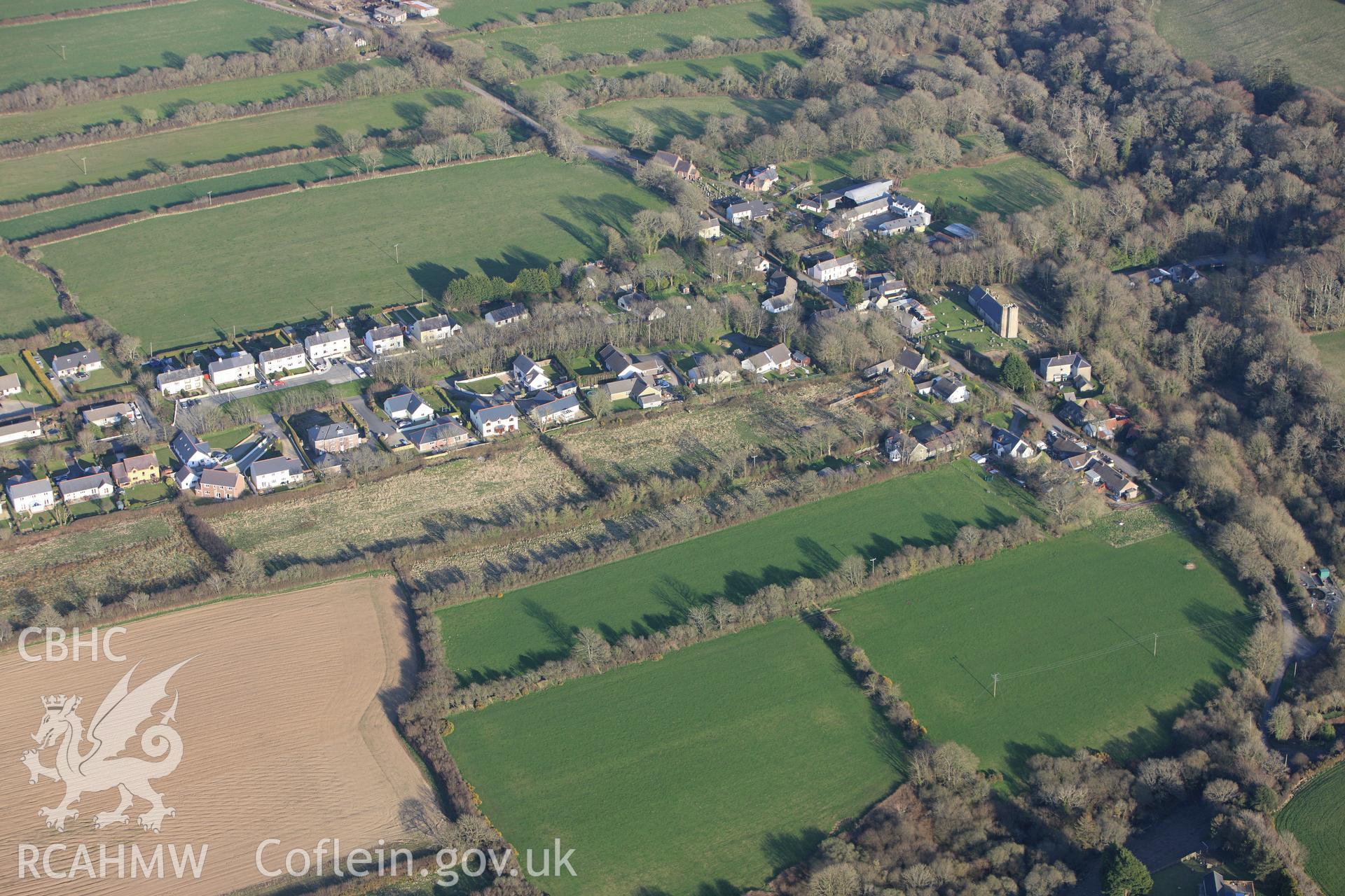 RCAHMW colour oblique aerial photograph of St Ismael's (St Ambrose's) Church, Camrose Village. Taken on 13 April 2010 by Toby Driver