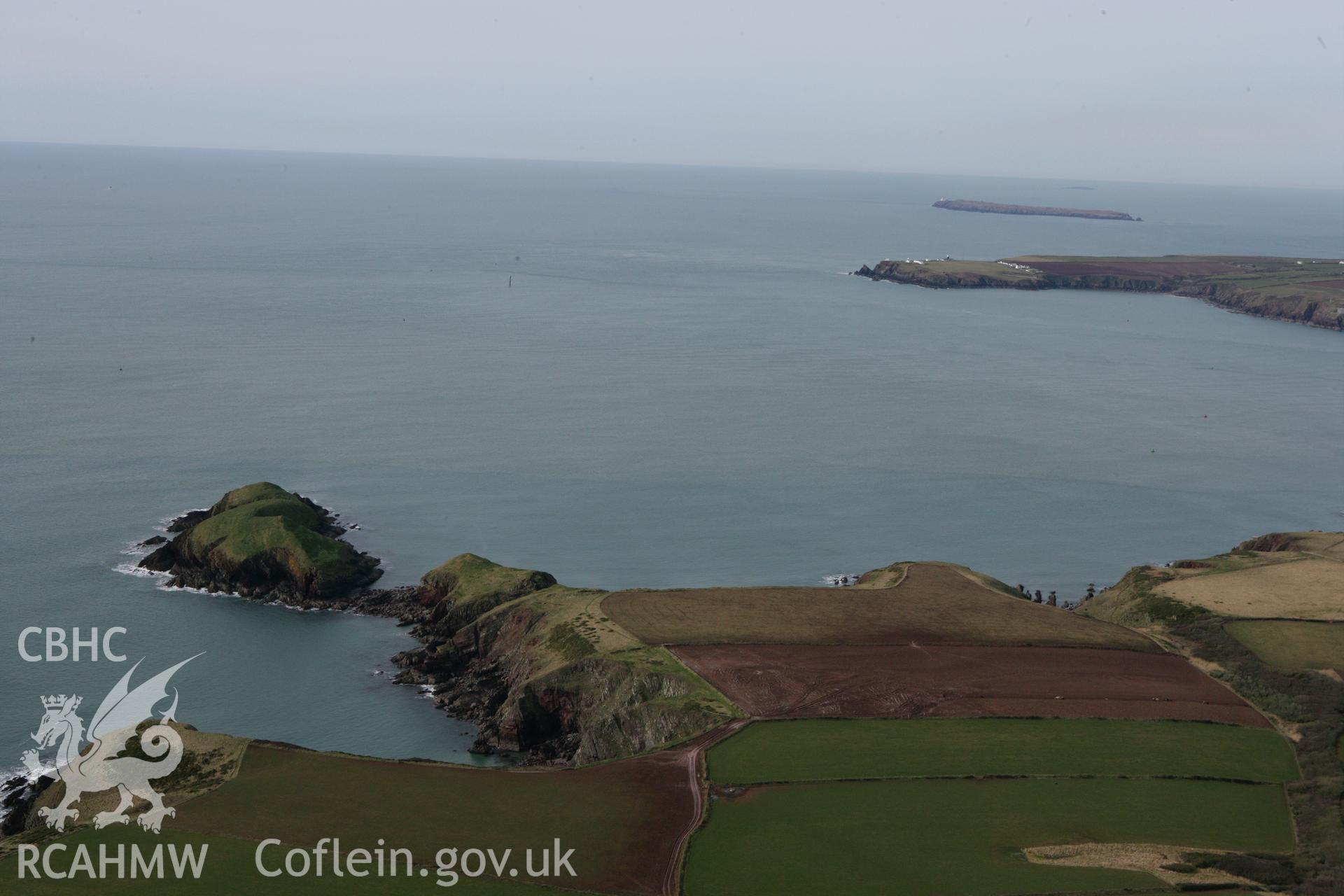 RCAHMW colour oblique aerial photograph of Sheep Island Promontory Fort. Taken on 02 March 2010 by Toby Driver