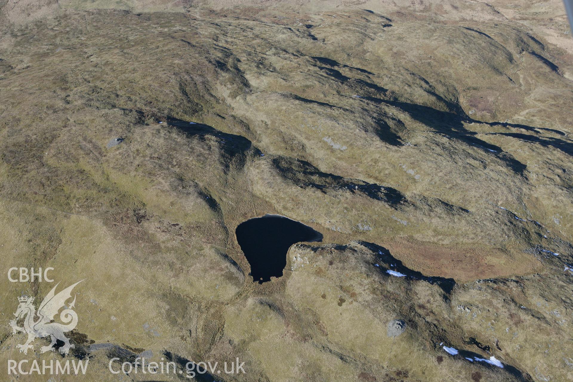 RCAHMW colour oblique photograph of Moel y Llyn cairn. Taken by Toby Driver on 08/03/2010.