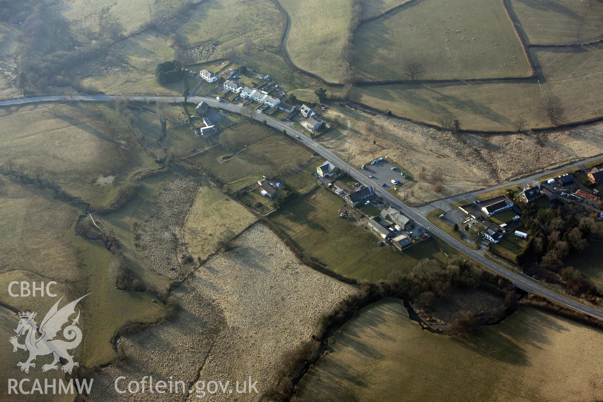 RCAHMW colour oblique photograph of Hundred House Common Barrow II. Taken by Toby Driver on 11/03/2010.