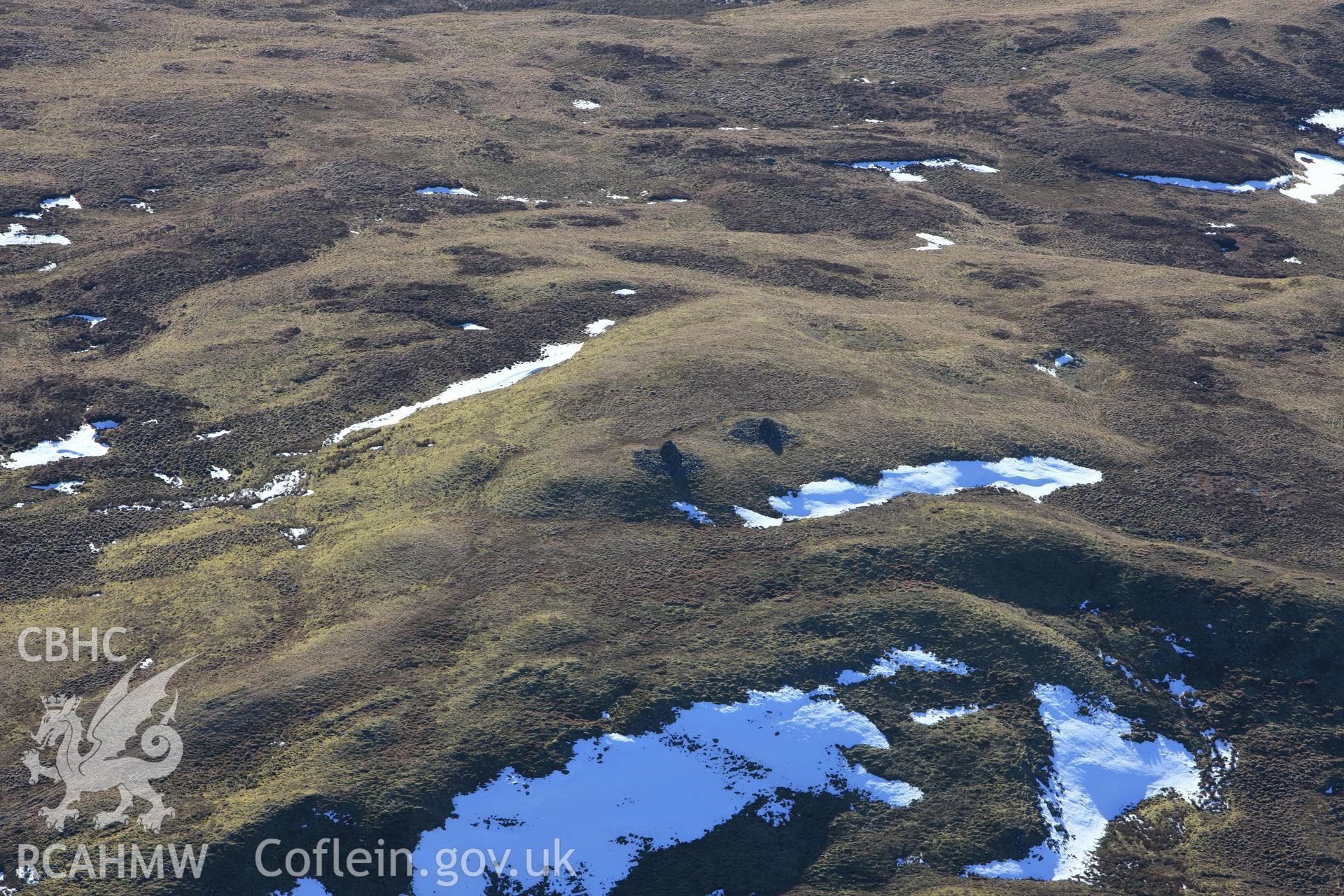 RCAHMW colour oblique photograph of Carn Gwilyn round cairns. Taken by Toby Driver on 08/03/2010.