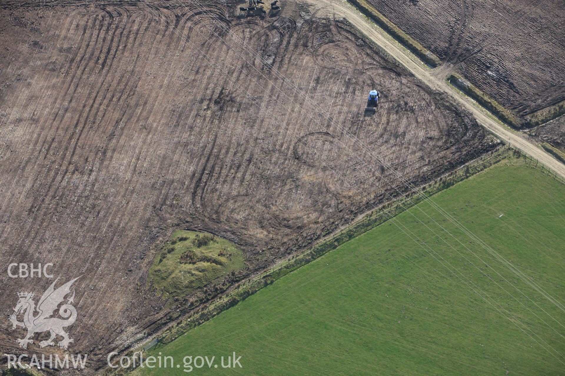 RCAHMW colour oblique aerial photograph of Cructarw with ploughing. Taken on 13 April 2010 by Toby Driver