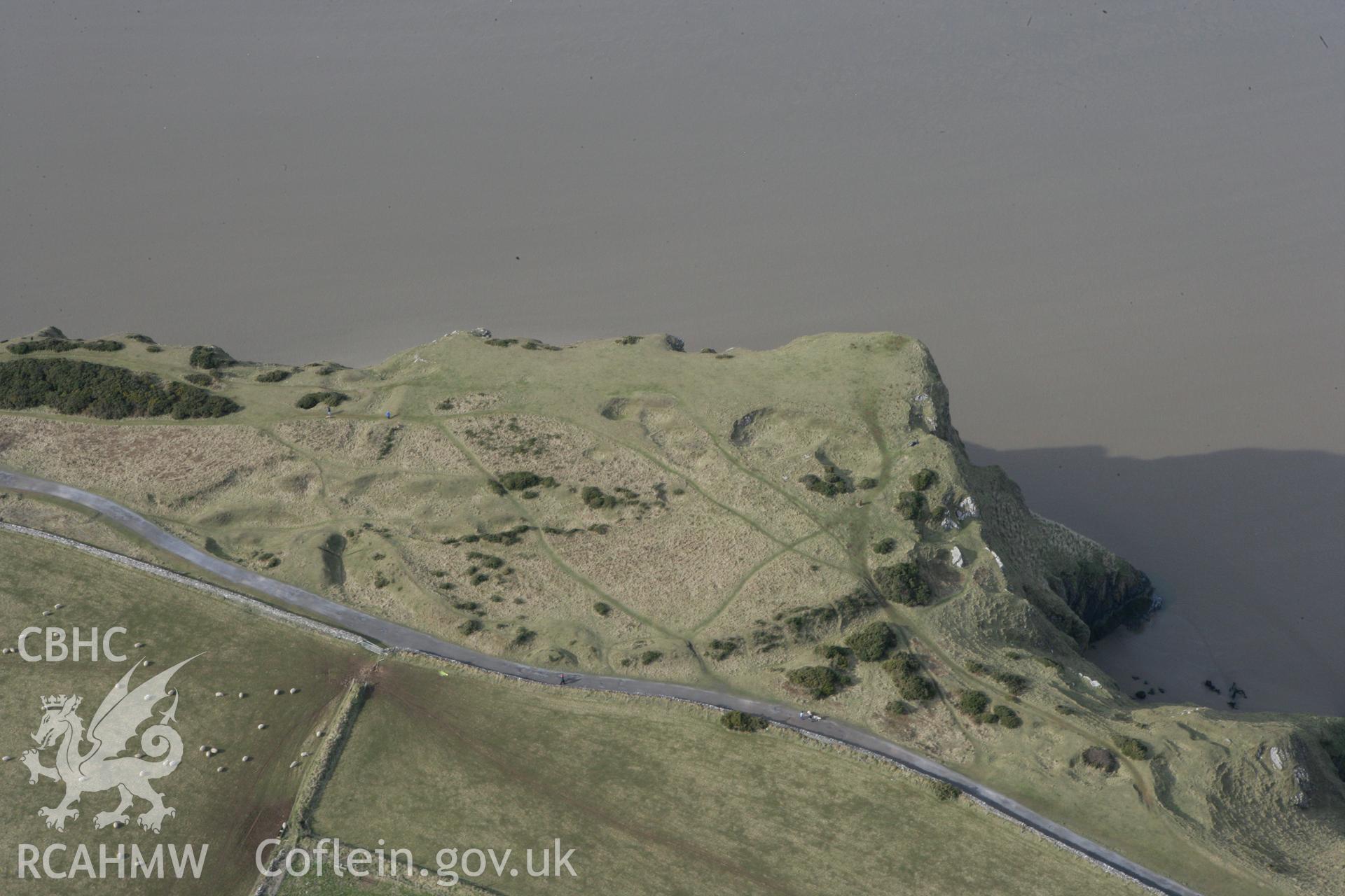 RCAHMW colour oblique photograph of Old Castle Promontory Fort. Taken by Toby Driver on 02/03/2010.