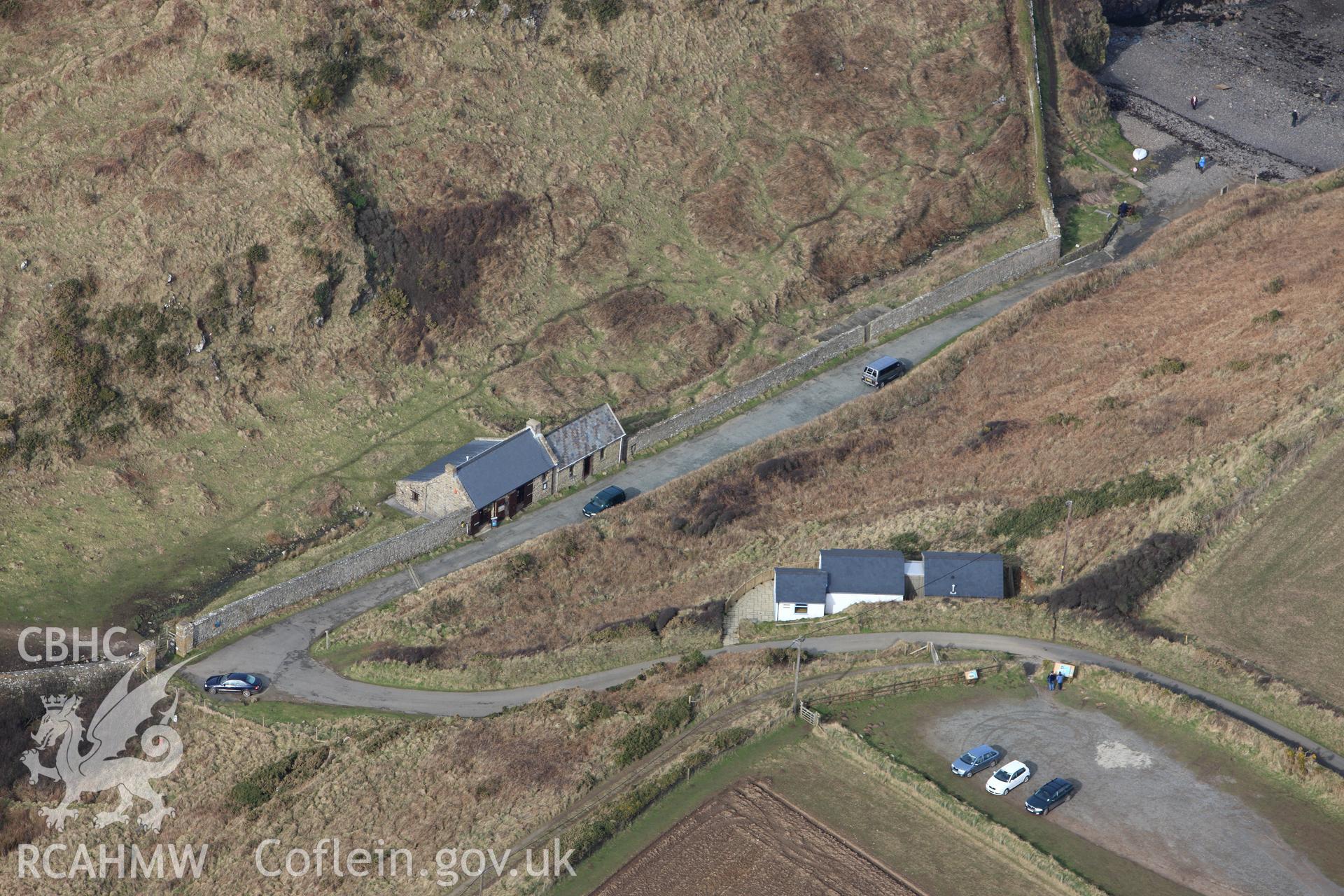 RCAHMW colour oblique aerial photograph of Martin's Haven Inscribed Stone. Taken on 02 March 2010 by Toby Driver