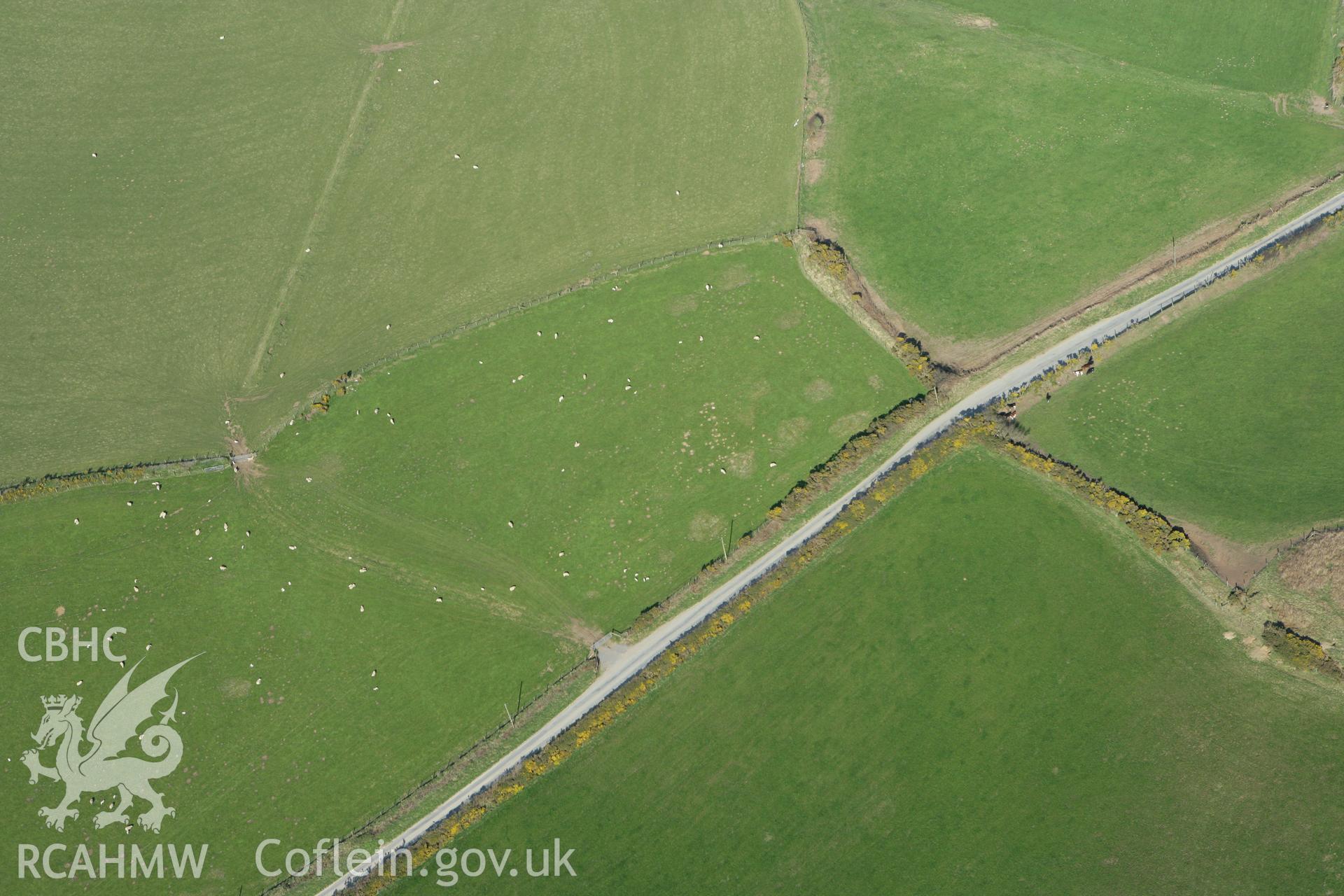 RCAHMW colour oblique aerial photograph of Crugiau Cemaes Barrow III, north barrows. Taken on 13 April 2010 by Toby Driver