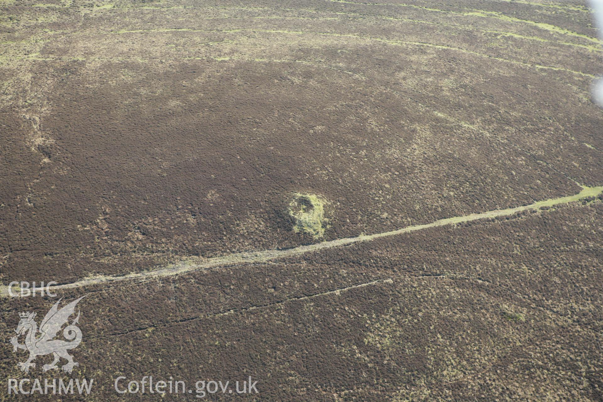 RCAHMW colour oblique aerial photograph of Frenni Fawr northwest cairn. Taken on 13 April 2010 by Toby Driver