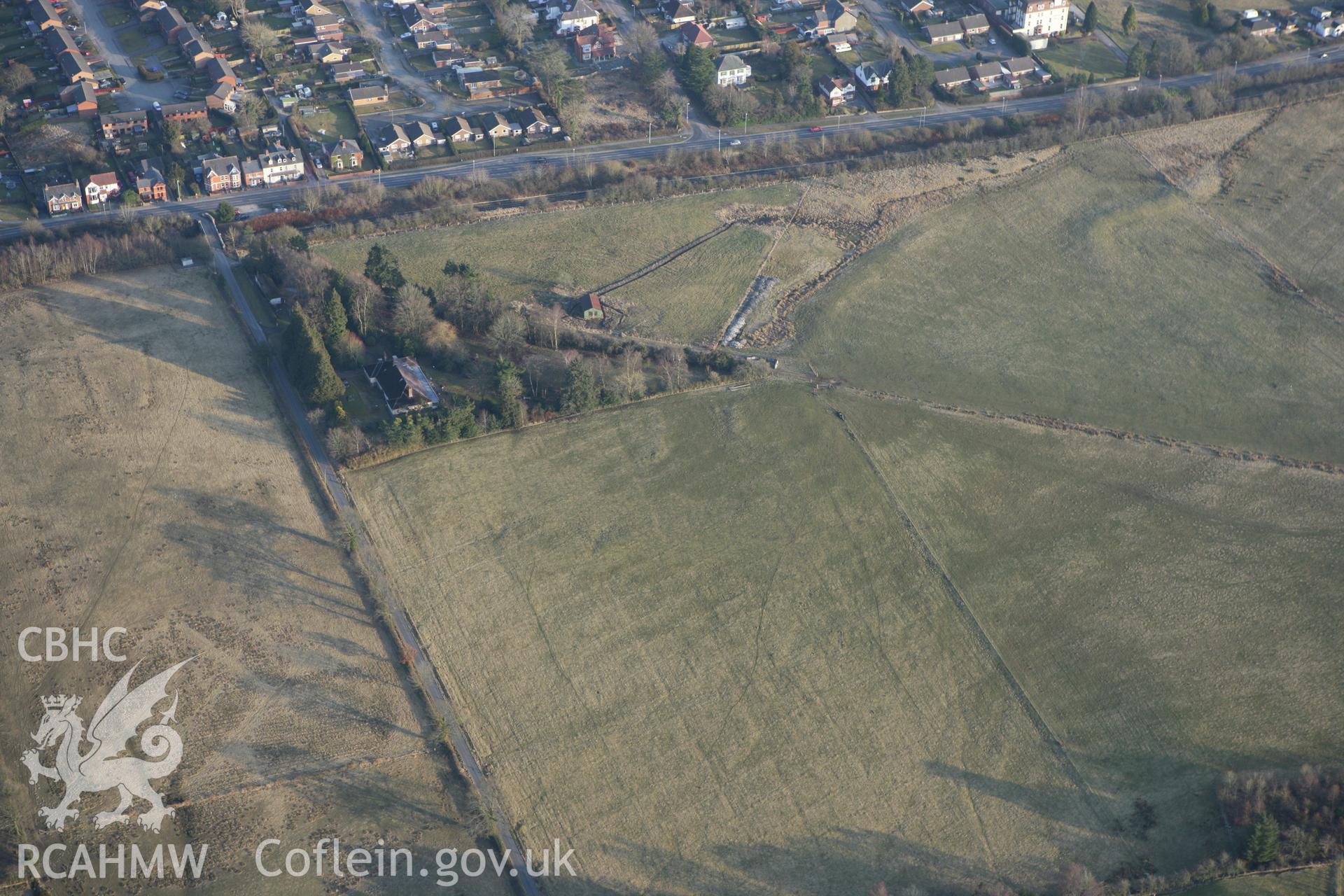 RCAHMW colour oblique photograph of Llandrindod Common Roman Practice Camps. Taken by Toby Driver on 11/03/2010.