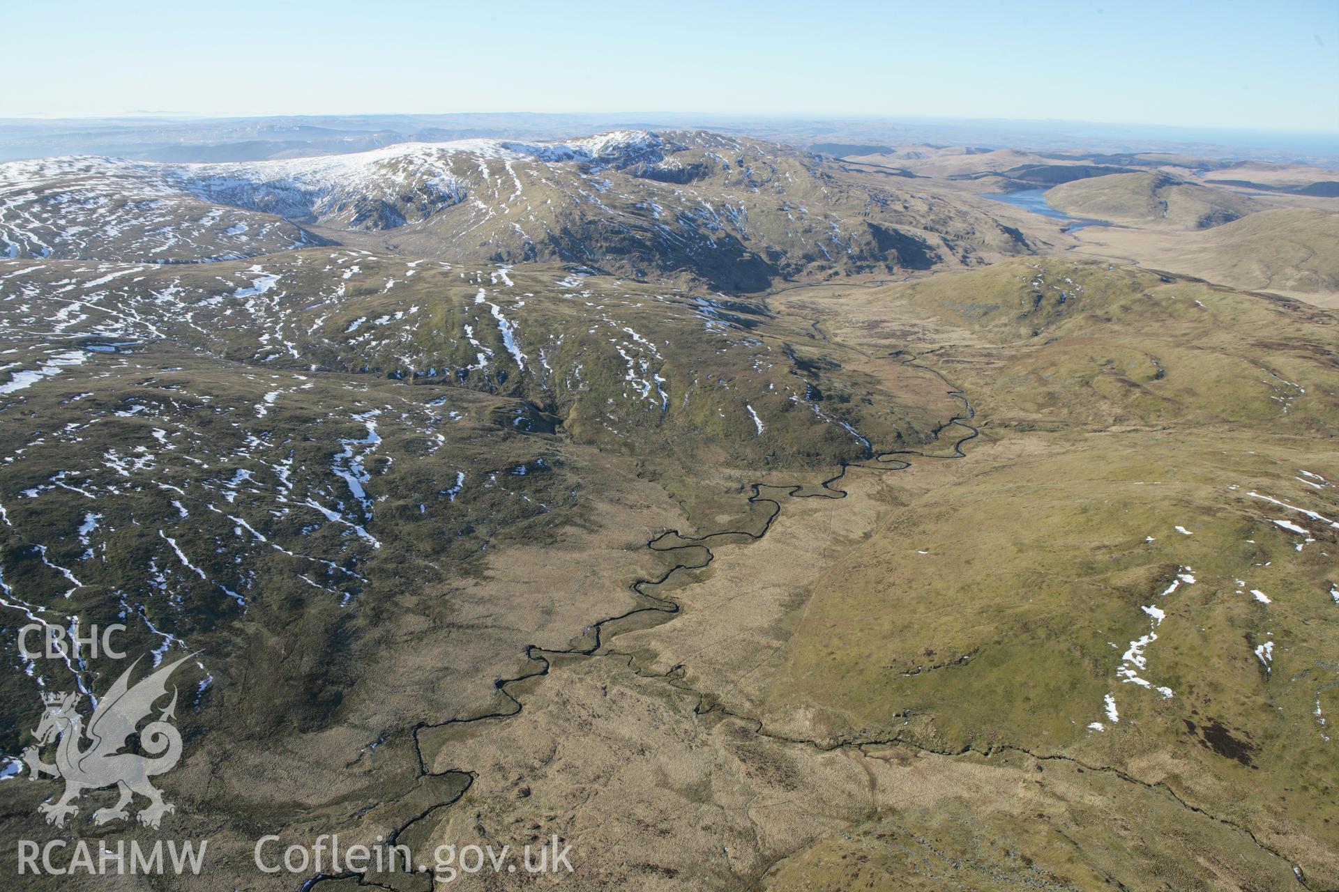 RCAHMW colour oblique photograph of Hut Circle settlement below Foel Isaf, Bugeilyn. Taken by Toby Driver on 08/03/2010.