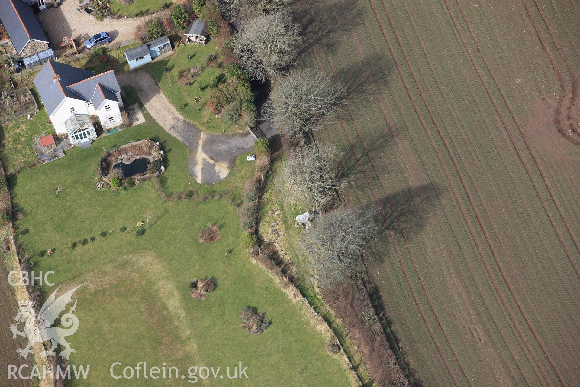 RCAHMW colour oblique aerial photograph of Hanging Stone Burial Chamber. Taken on 02 March 2010 by Toby Driver