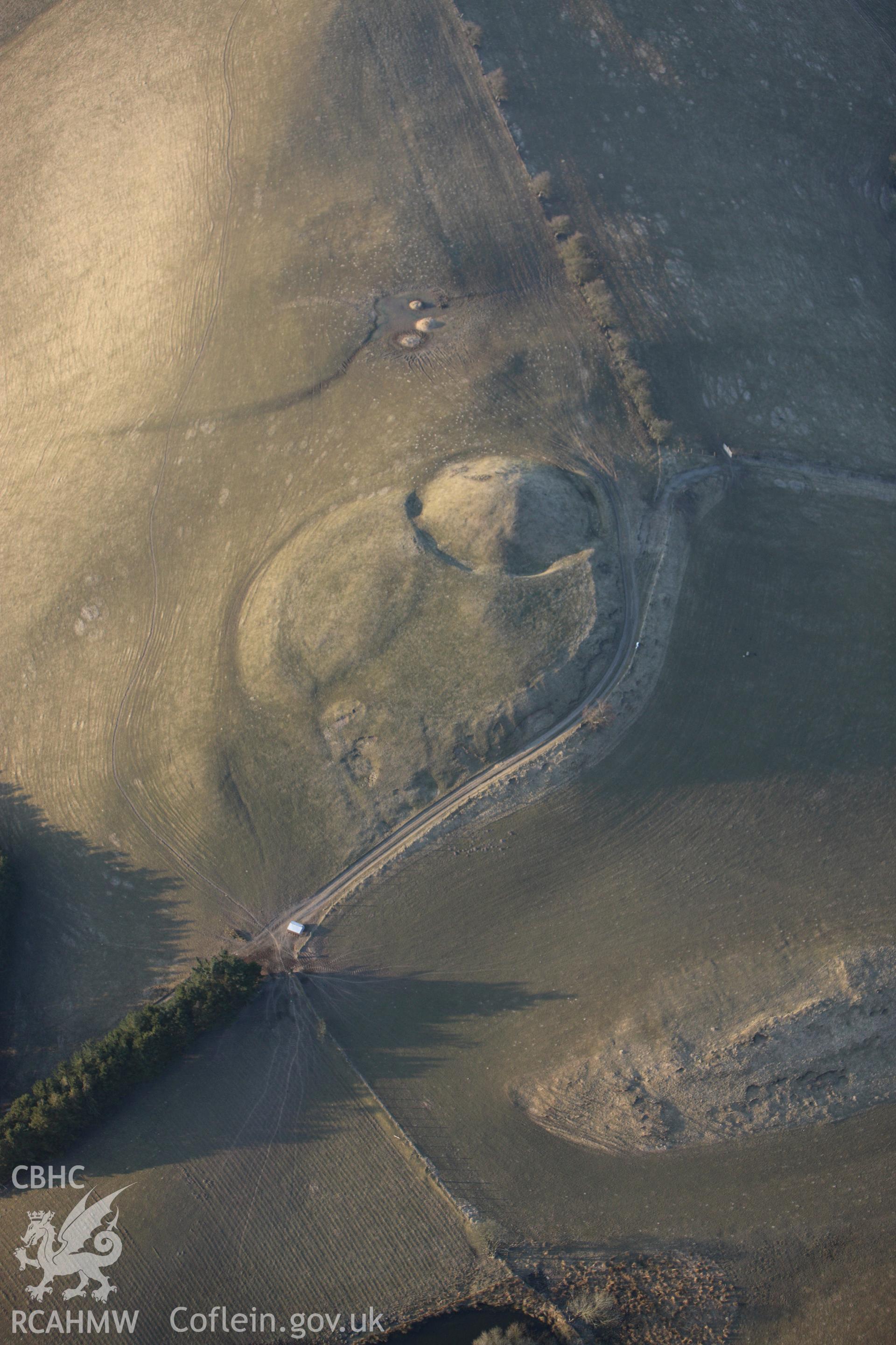 RCAHMW colour oblique photograph of Tomen Bedd-Ugre Motte and Bailey. Taken by Toby Driver on 11/03/2010.