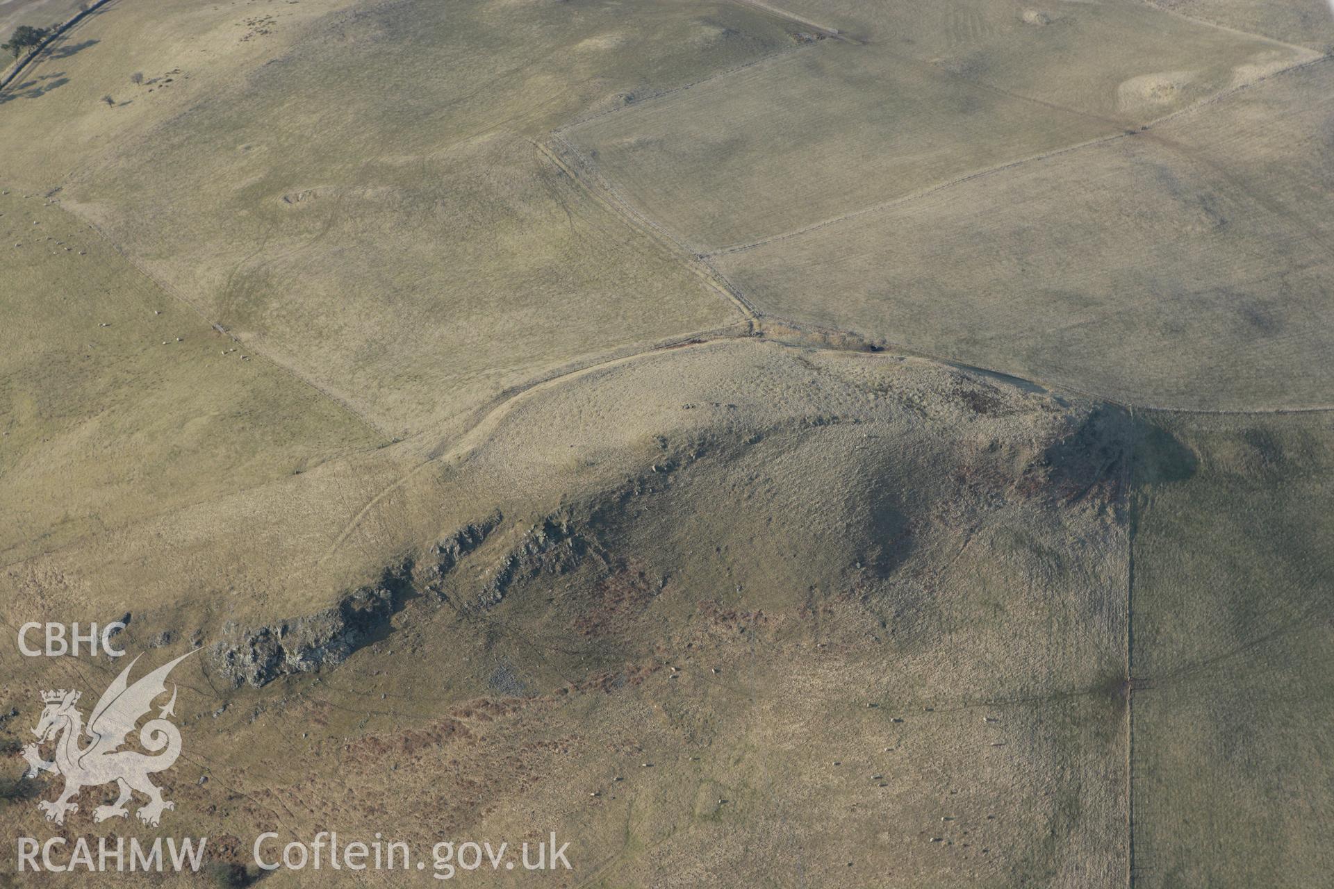 RCAHMW colour oblique photograph of Careg-wiber, defended enclosure. Taken by Toby Driver on 11/03/2010.